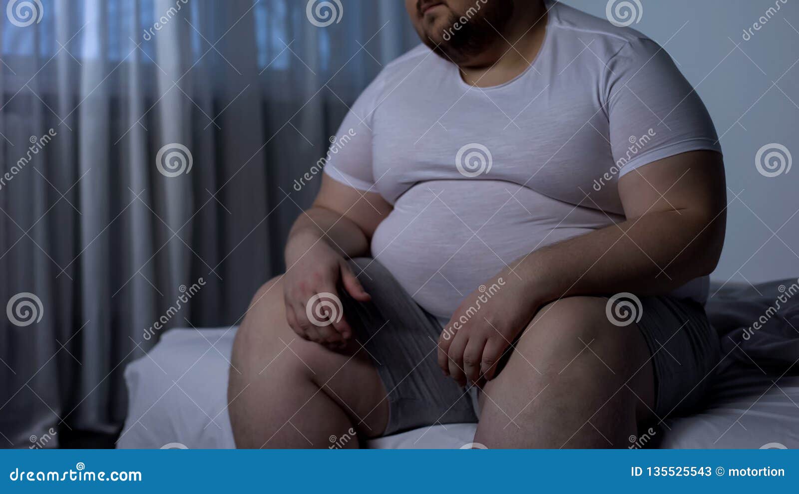 obese man feels heaviness and pain in stomach, abdominal bloating, indigestion