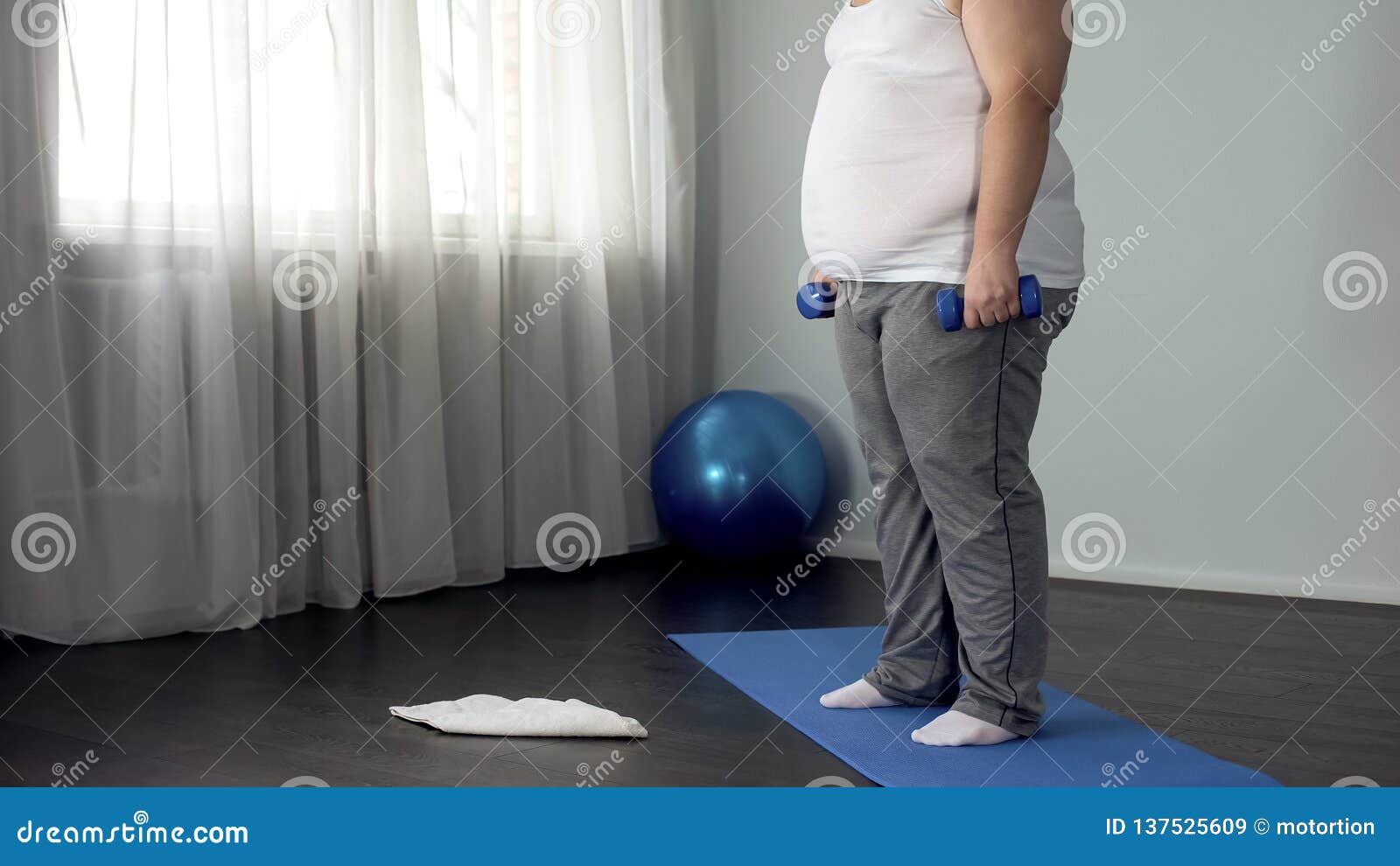 obese man lifting dumbbells, working out at home, burning calories, motivation