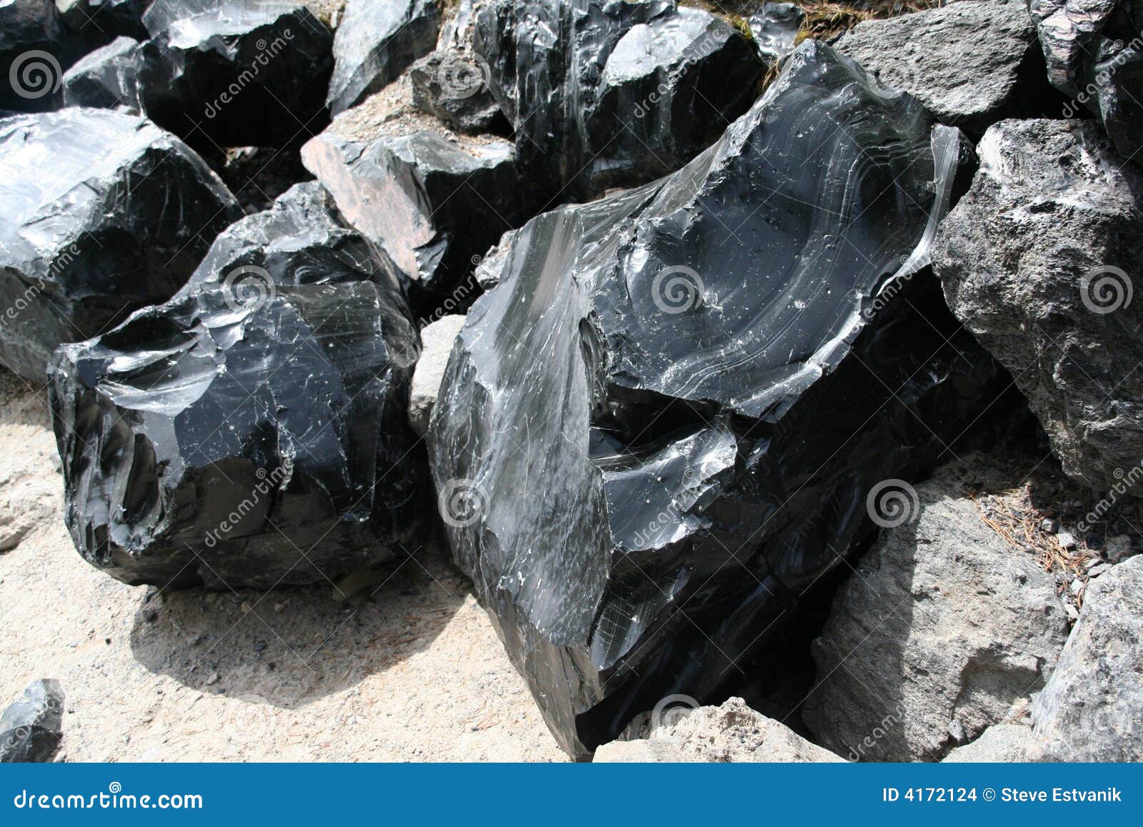 obsidian boulders from lava flow