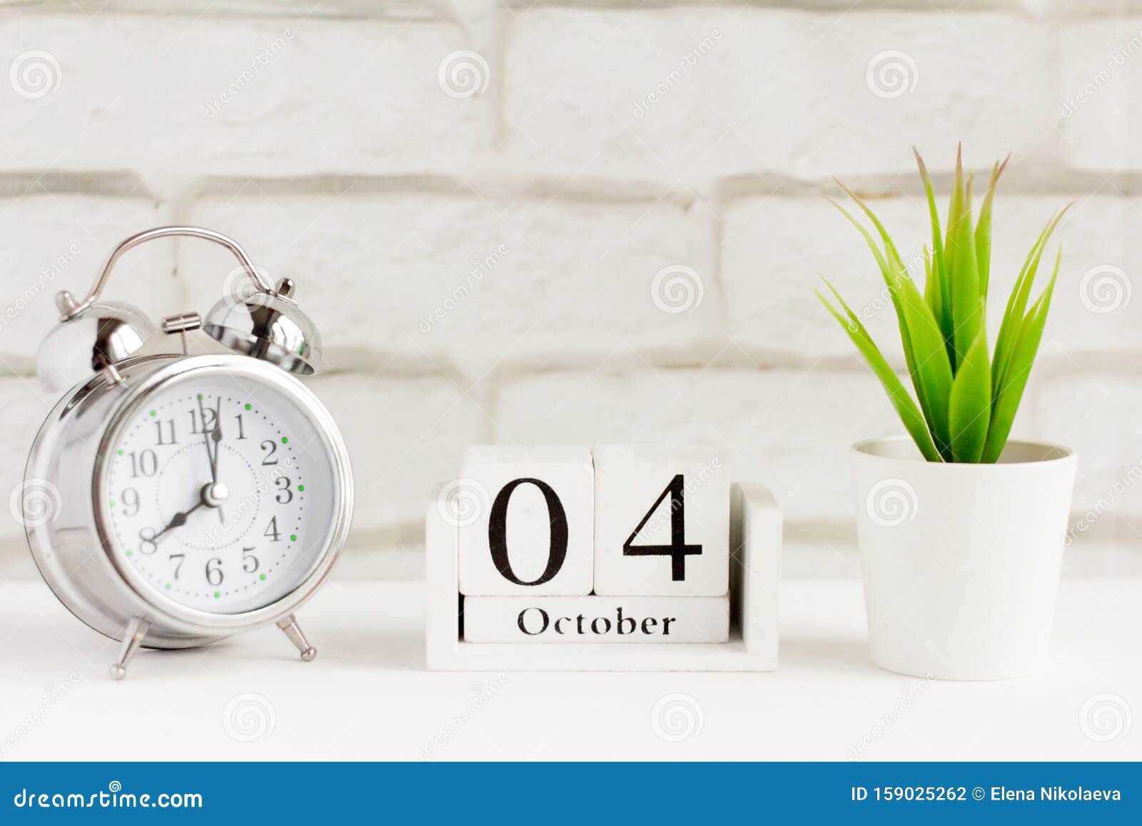 October 4 on the Wooden Calendar Next To the Alarm Clock, the Date of