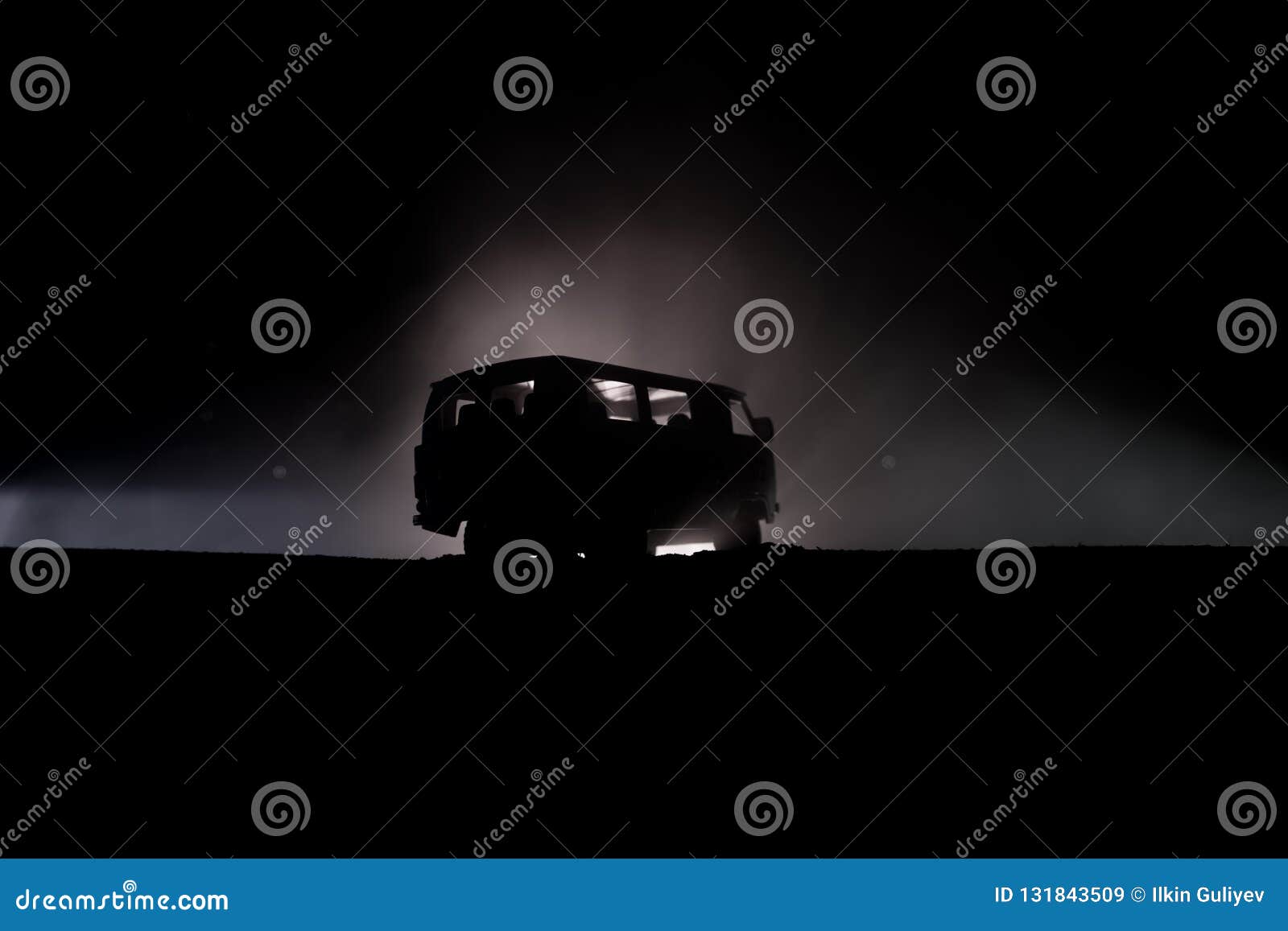 off roader jeep silhouette on dark toned foggy sky background. car with light at night