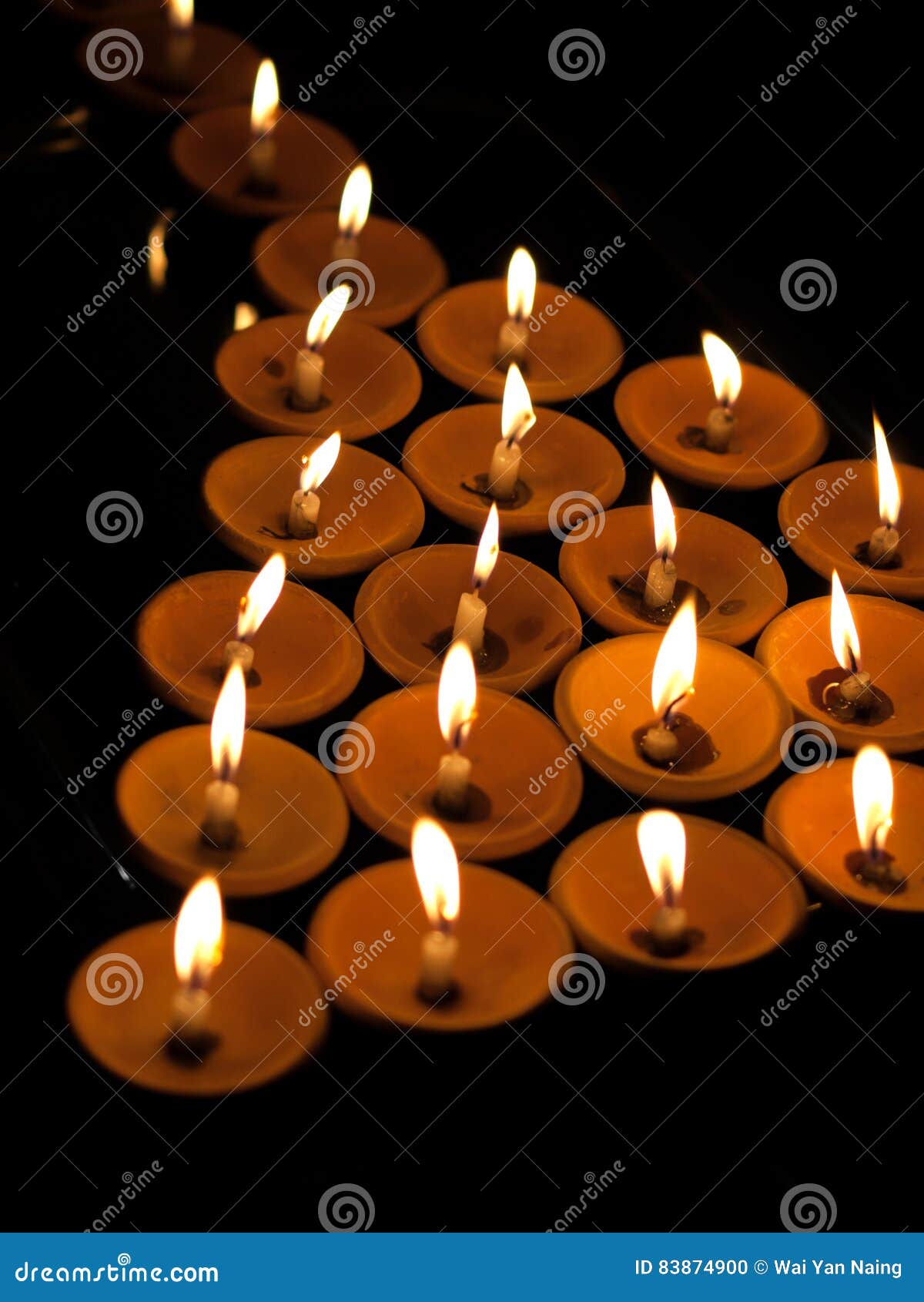 OFFERING LIT CANDLES stock photo. Image of divine, church 83874900