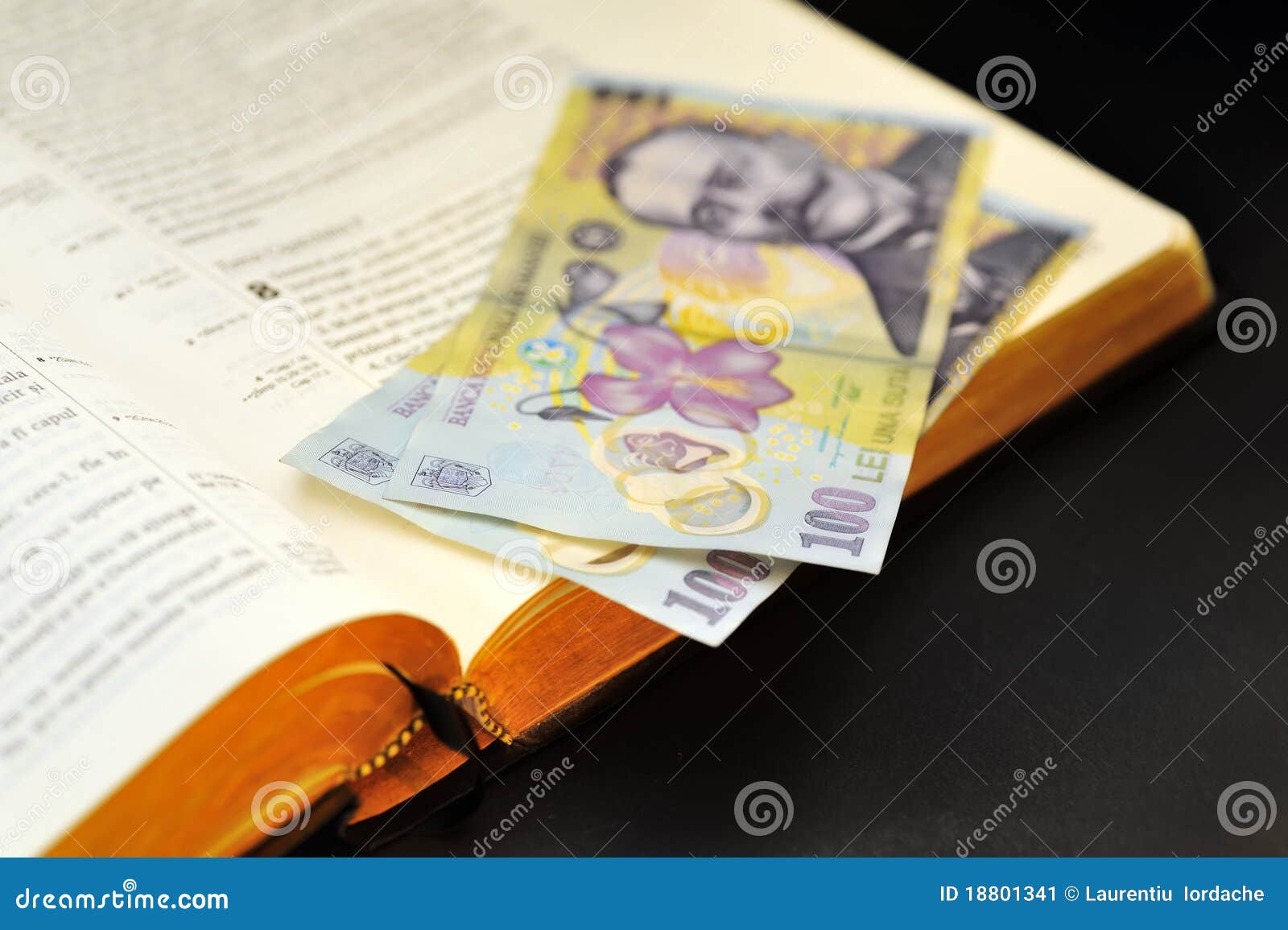 offering romanian currency and holy bible
