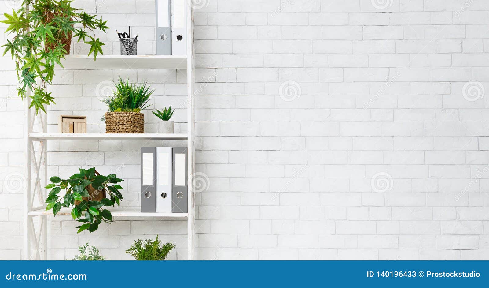 office bookcase with plants and folders over wall