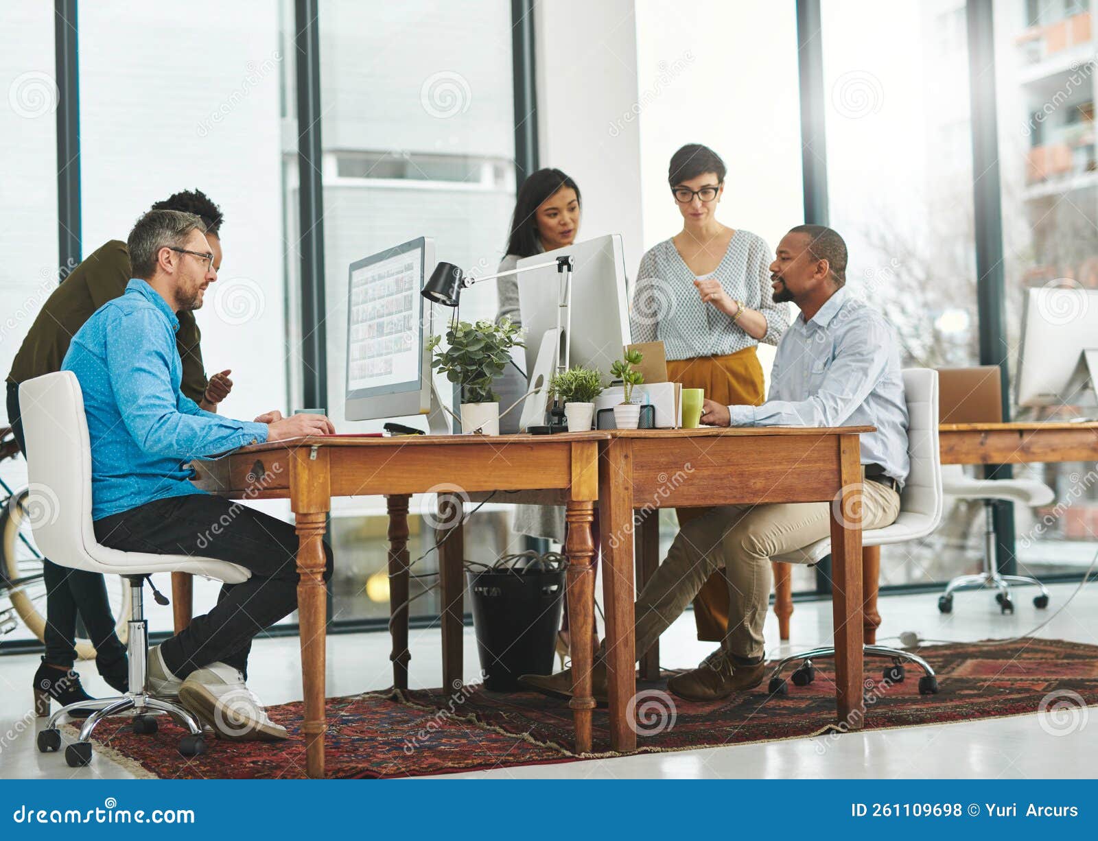 The Office is Buzzing. Full Length Shot of a Group of Colleagues