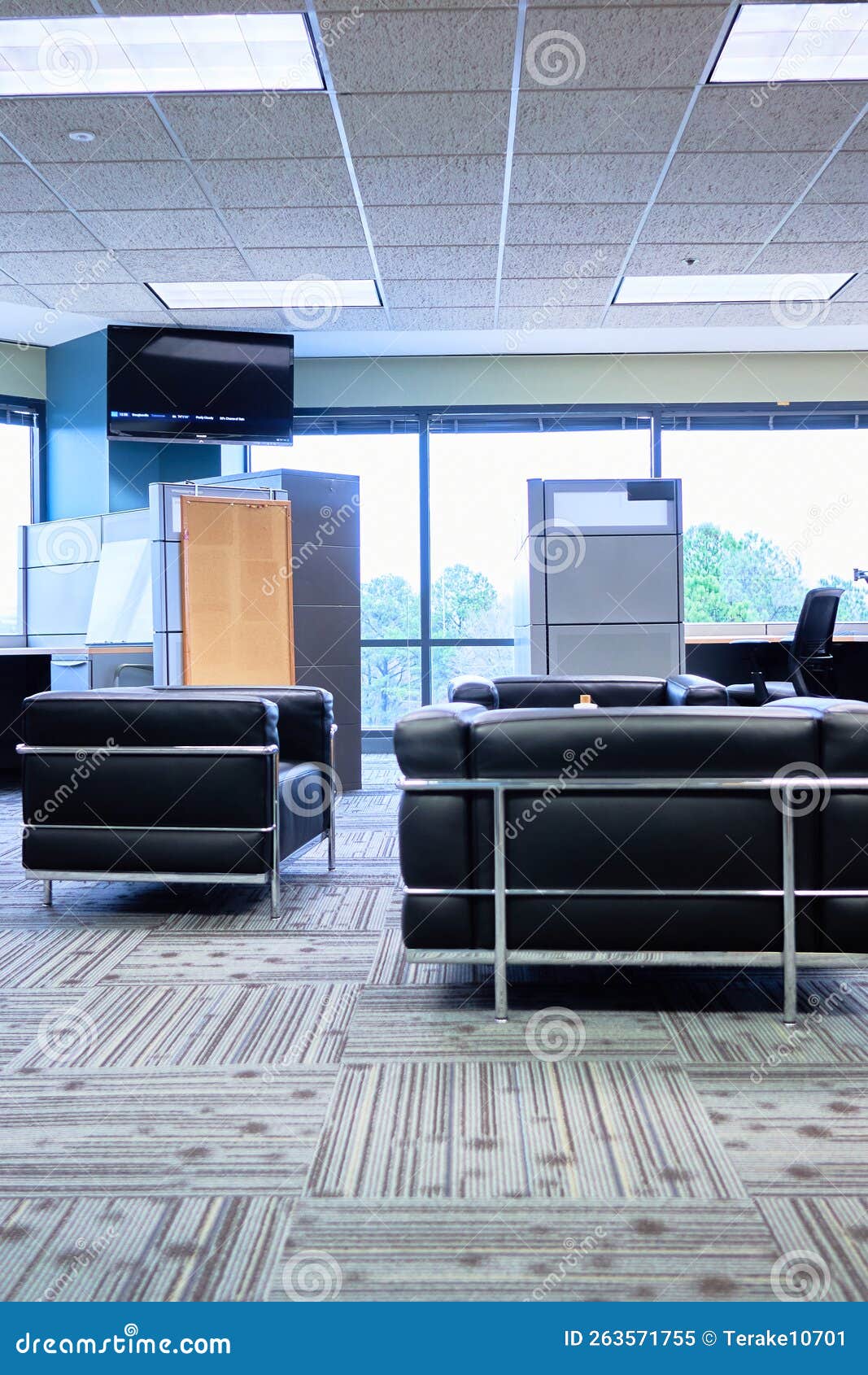 Office Cubes Cubical Black Office Chairs Wood Table in the Center Stock