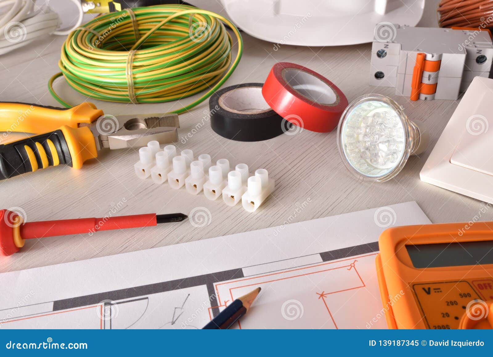 Office Desk of Electrical Engineer with Project and Tools Elevated
