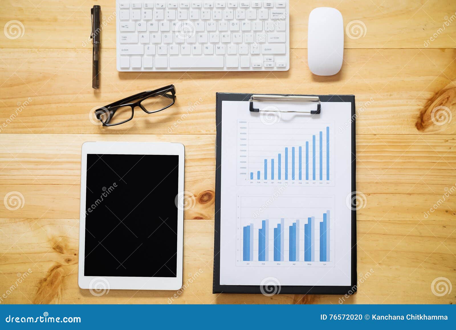 office desk table with computer, supplies, analysis chart, calcu