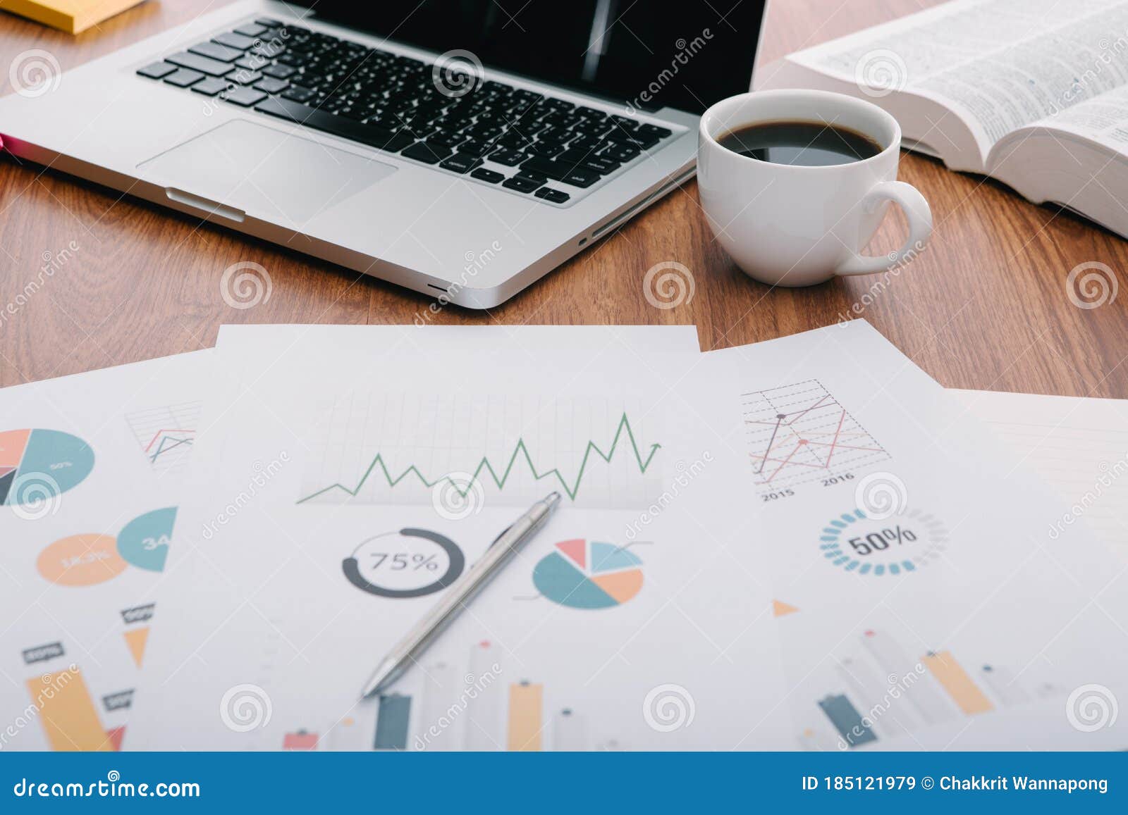 Office Desk Table with Computer, Supplies, Analysis Chart, Stock Image