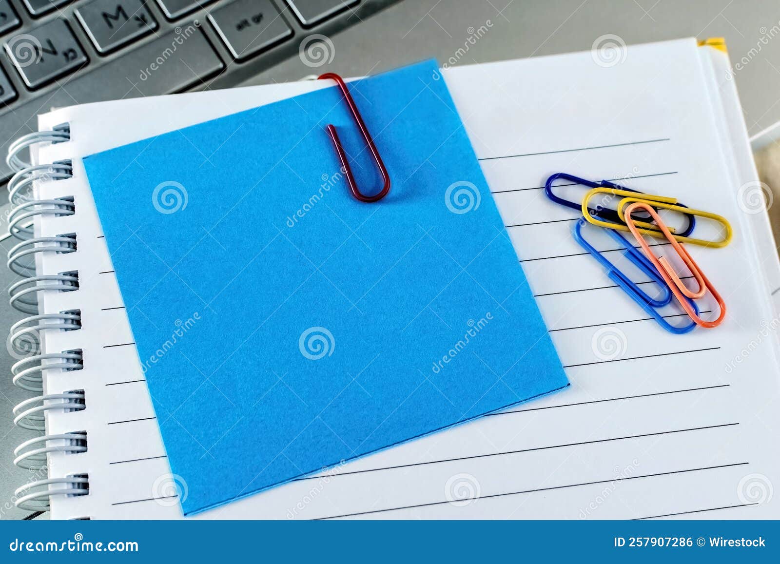 Office Desk Table with Keyboard, Supplies and Notebook. Stock Photo