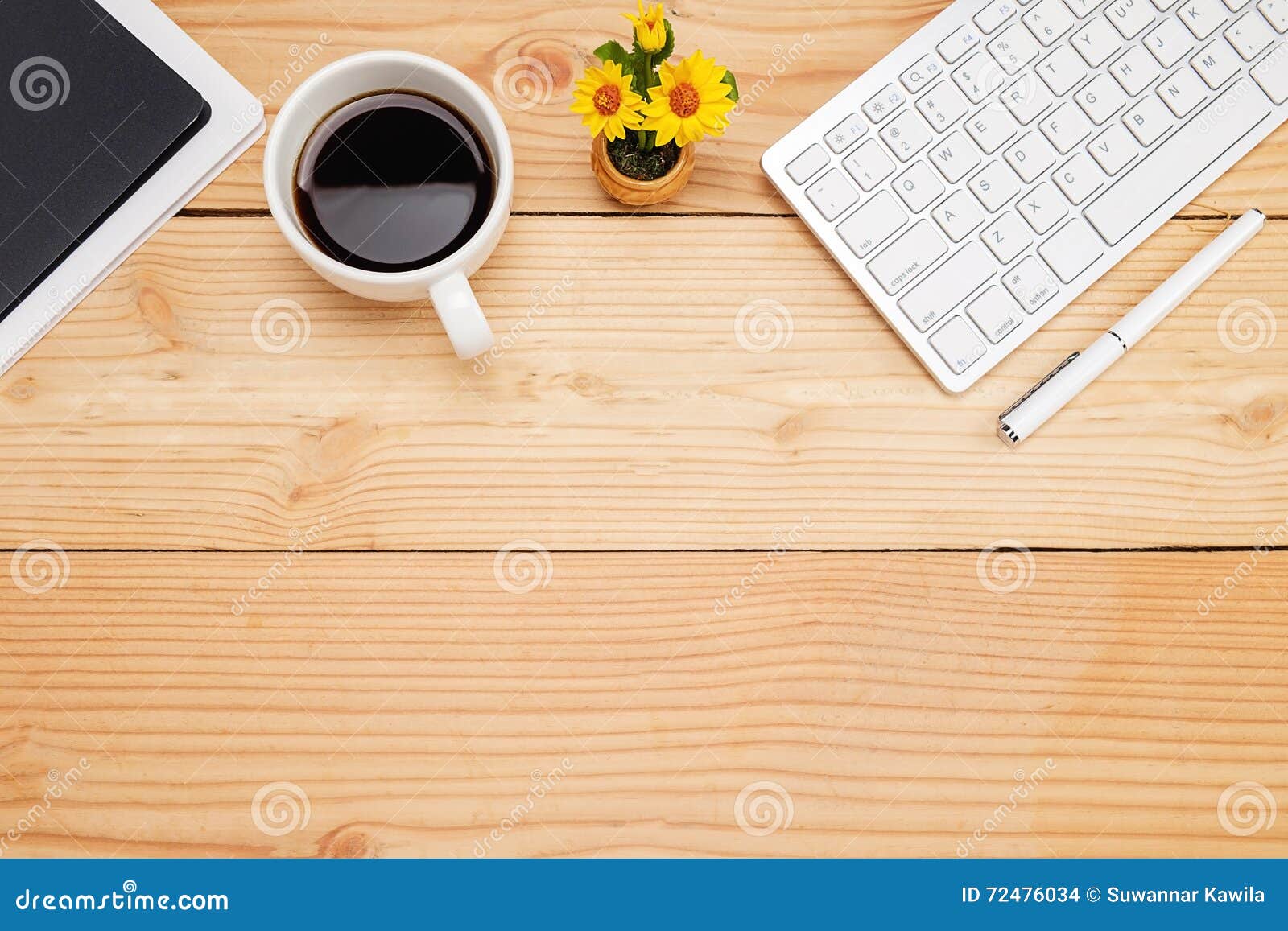 Office Desk Table with Smartphone, Pen on Notebook, Cup of Coffee and