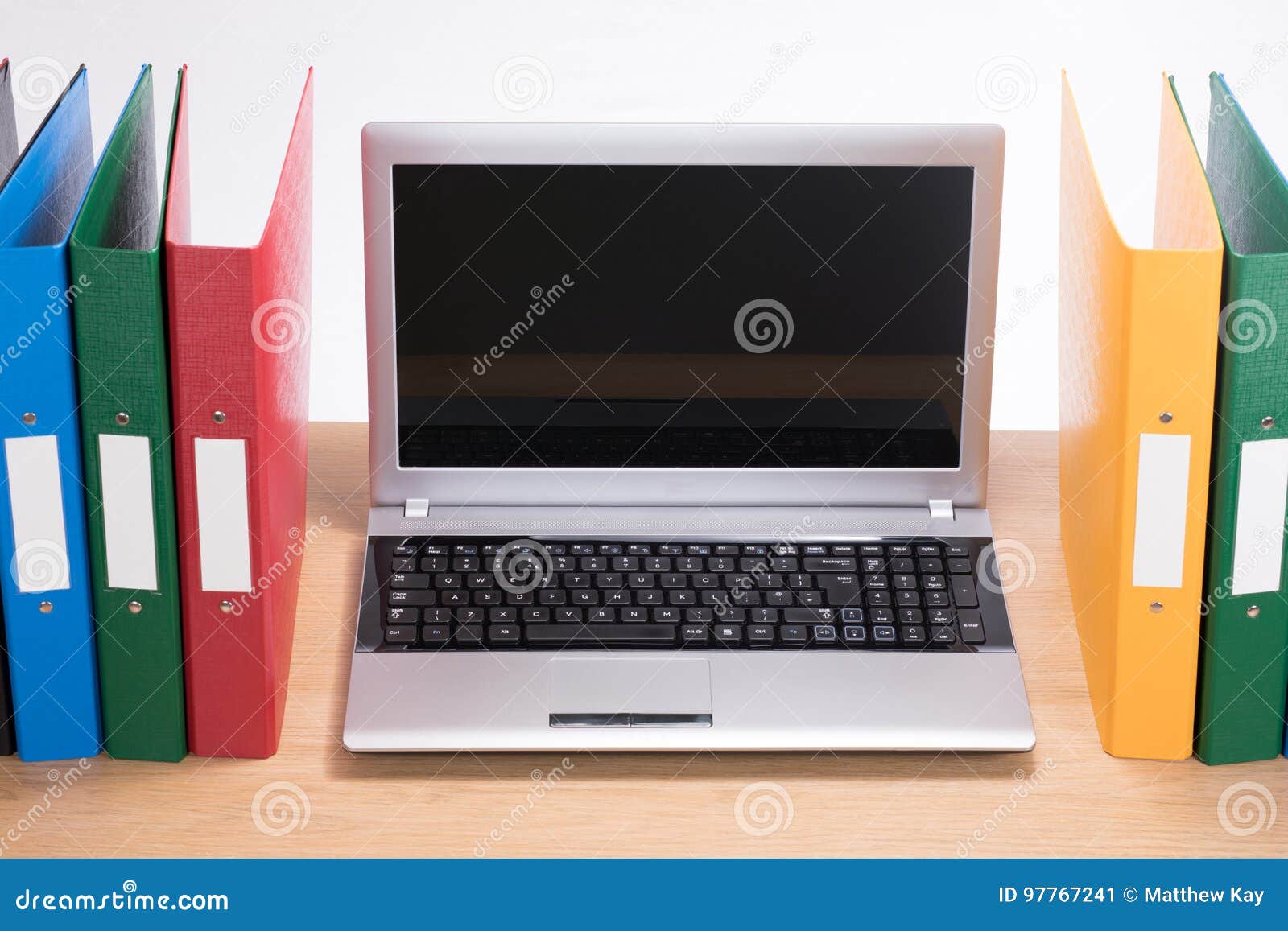 Office Folders And Open Laptop Computer On Desk Stock Image