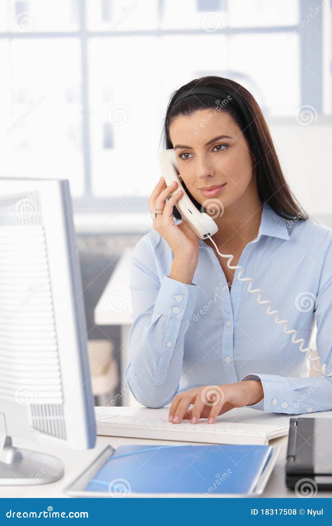 office girl on landline call