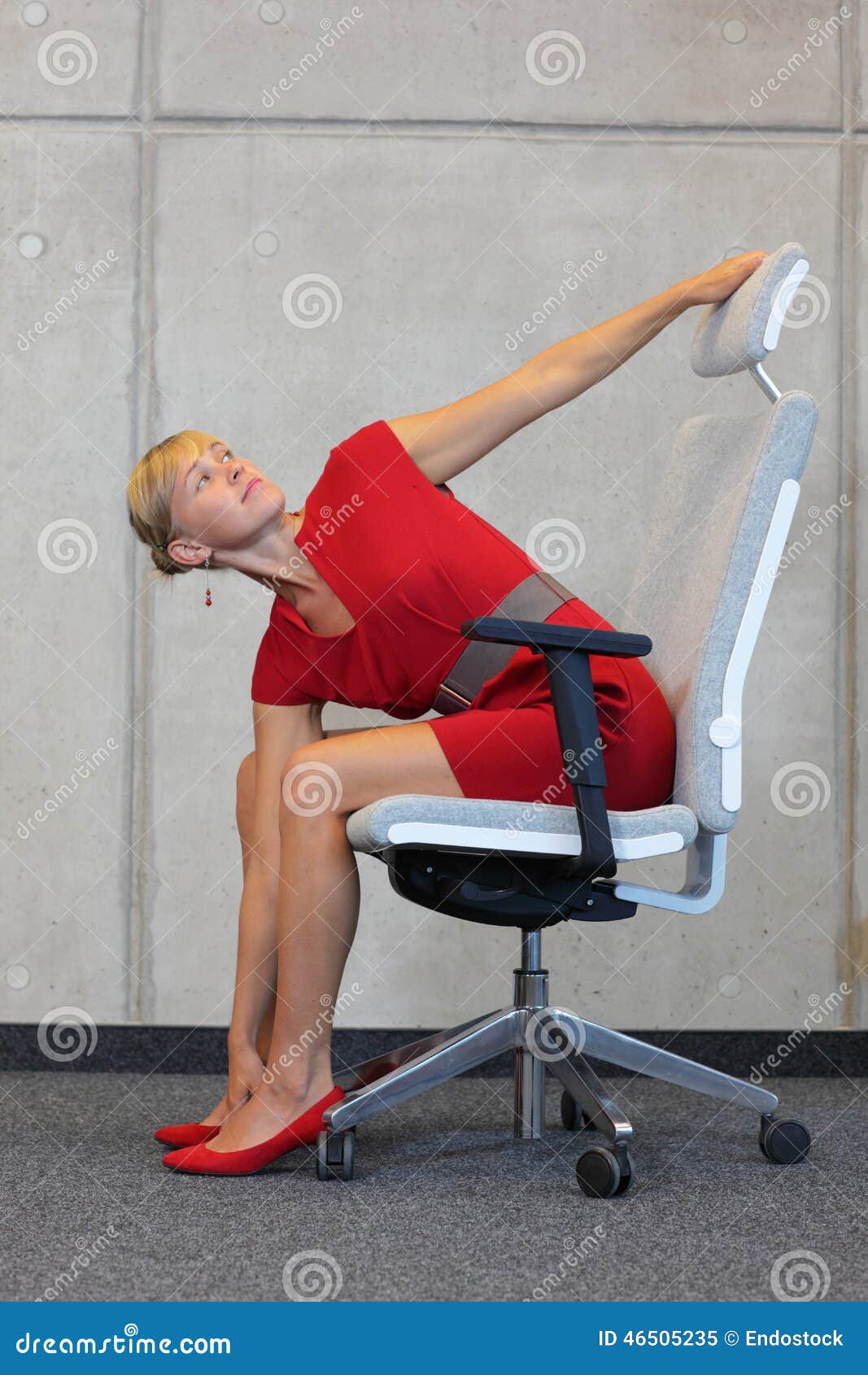 A 20-year-old female trainer practices Pilates on an elevator