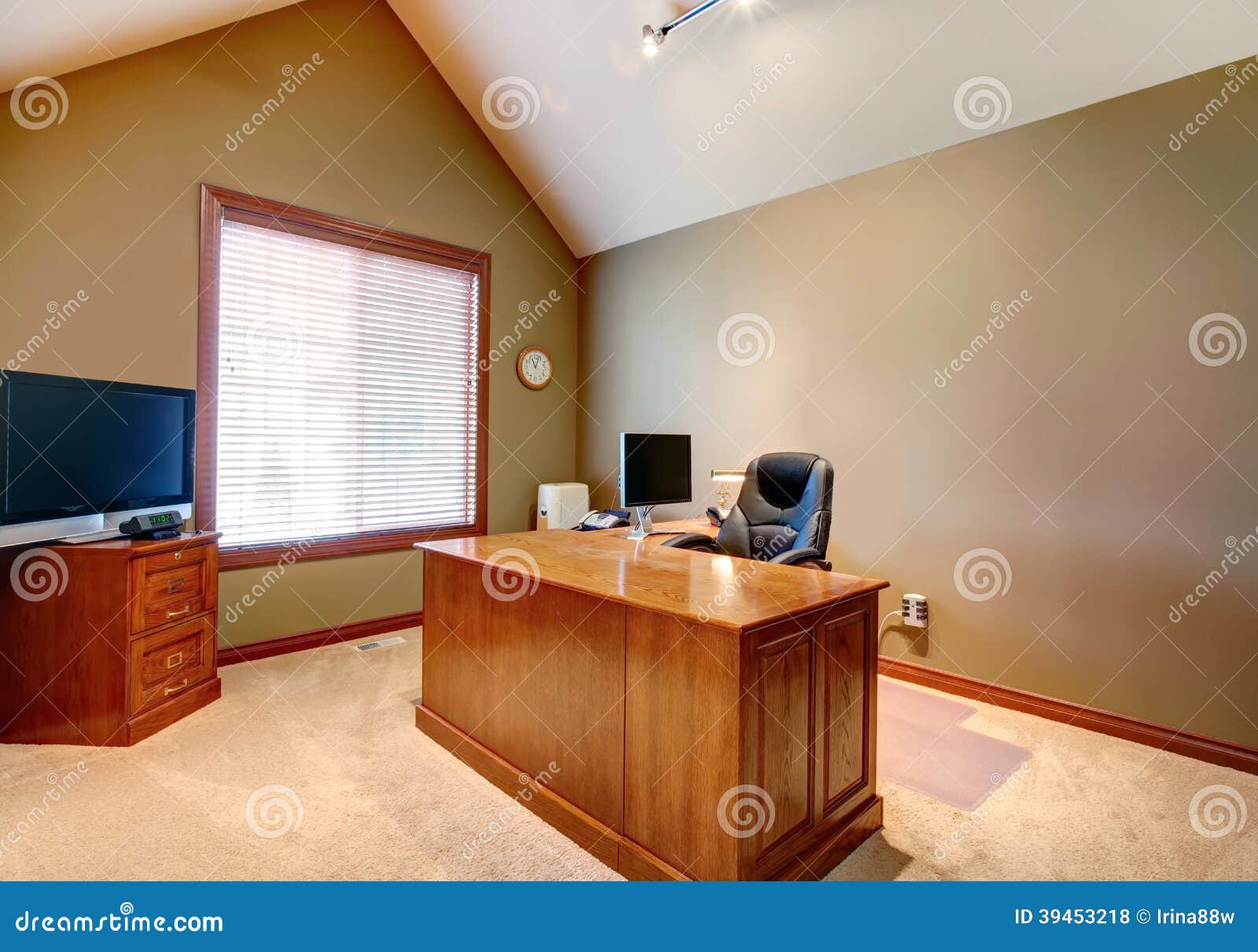 office room with high vaulted ceiling