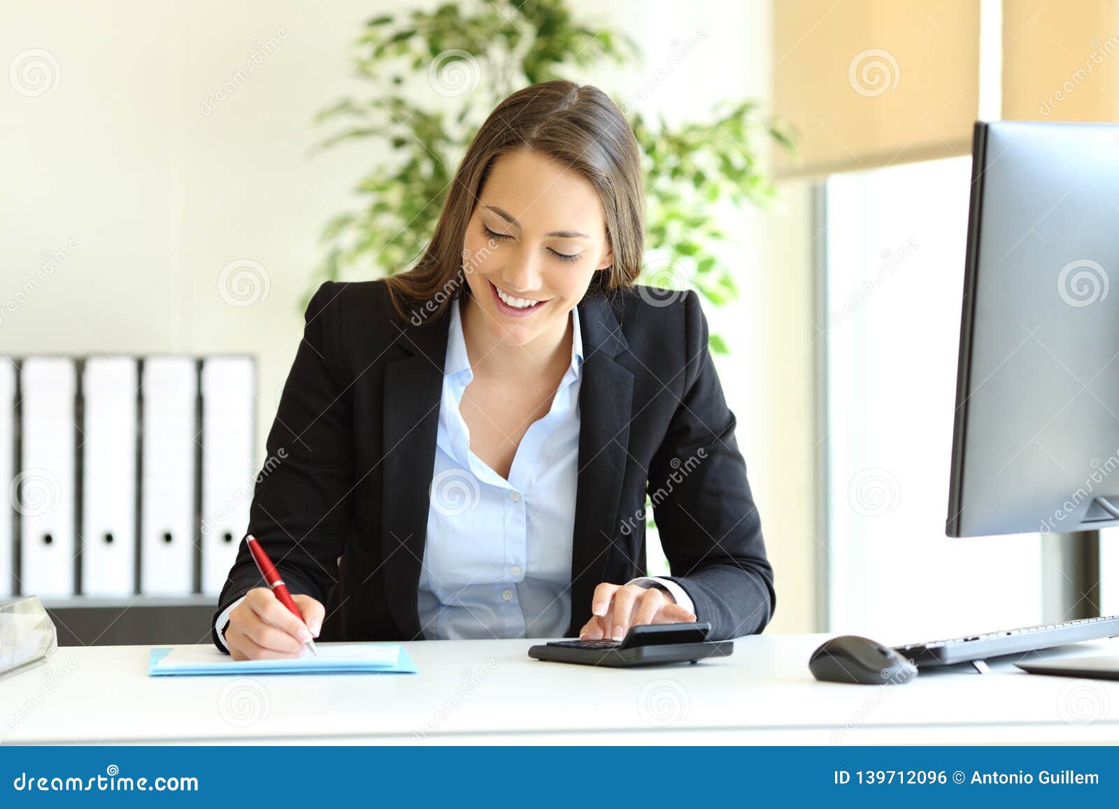 office worker calculating using calculator