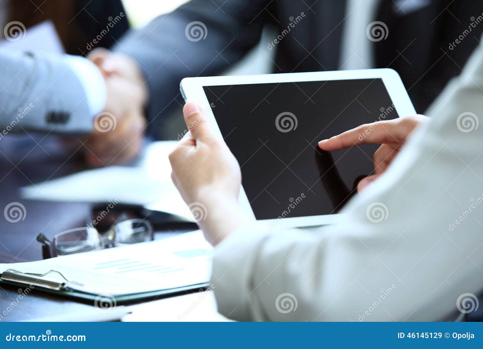 office worker using a touchpad to analyze statistical data
