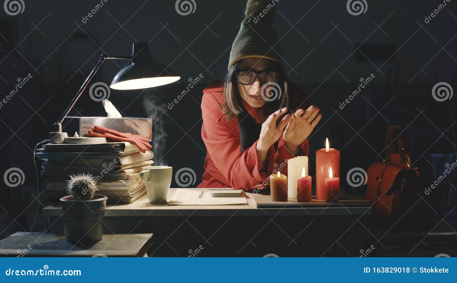 office worker working late at night and freezing