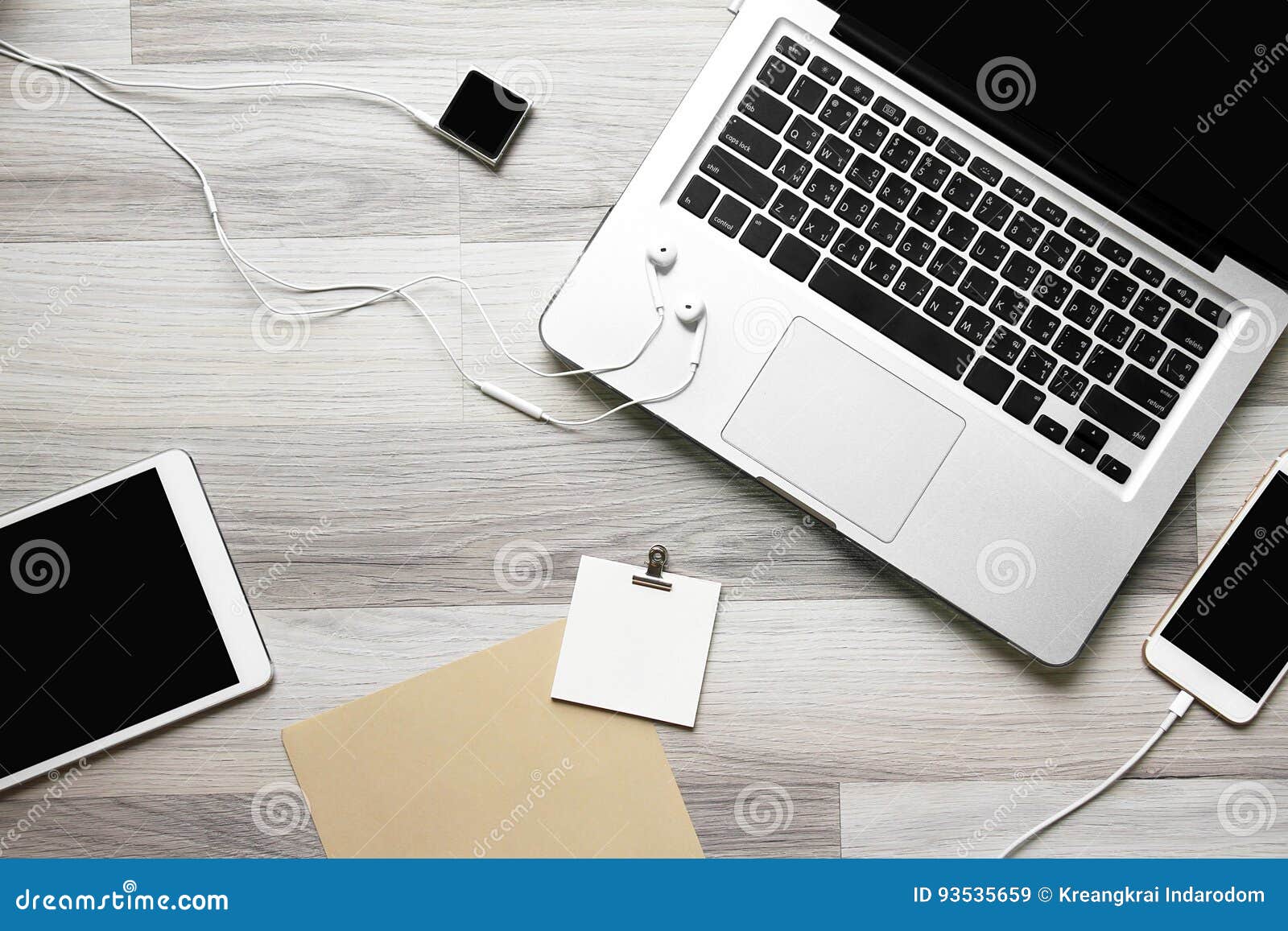 Office Workplace with Laptop, Tablet Computer and Smartphone. Stock