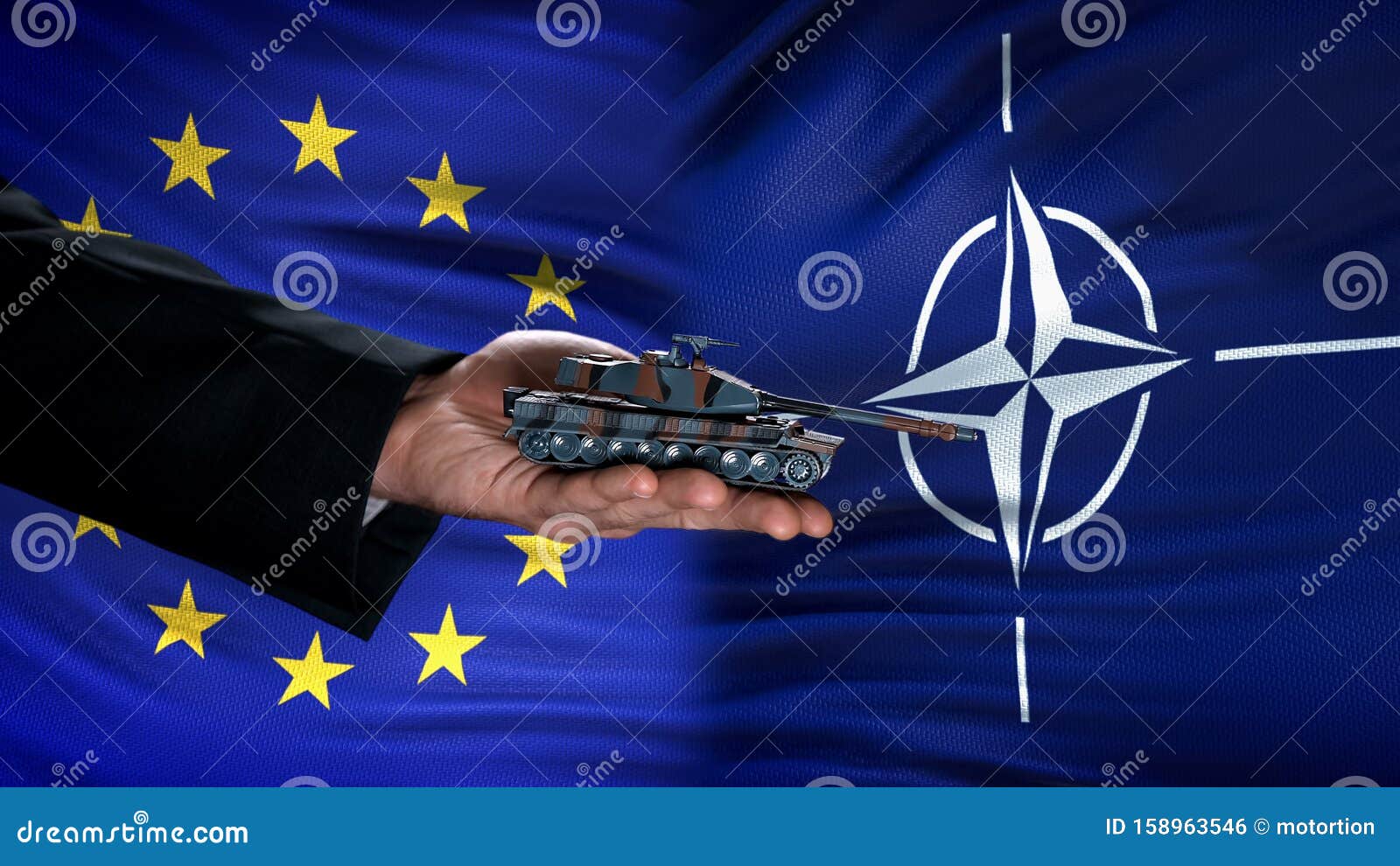 official hand holding toy tank against eu and nato flags, military agreement