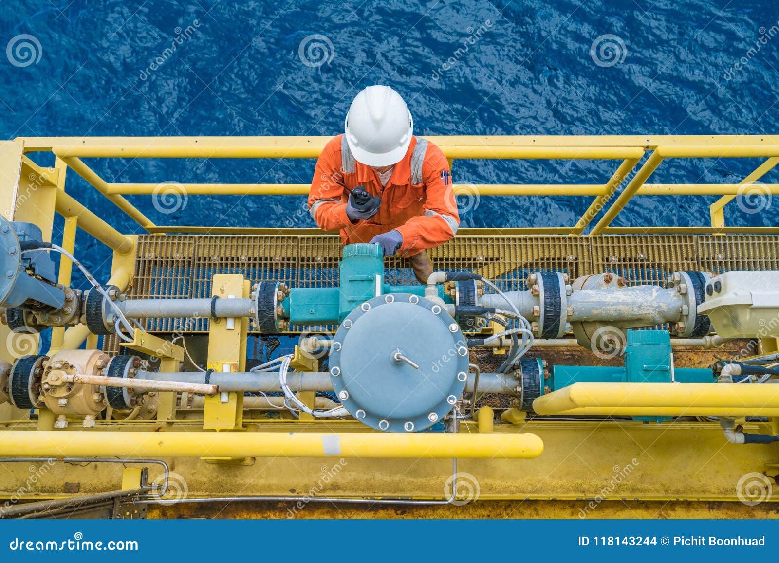 offshore-oil-rig-worker-checking-parameter-of-coriolis-digital-flow