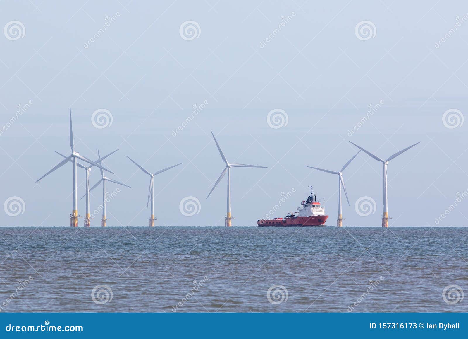 offshore wind farm turbines with maintenance supply vessel ship