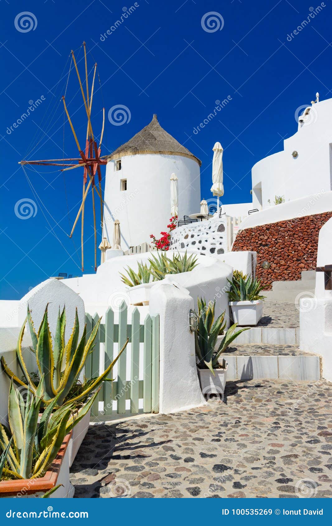 Windmill On The Streets Of Oia Santorini Greece Calderaaegea Stock