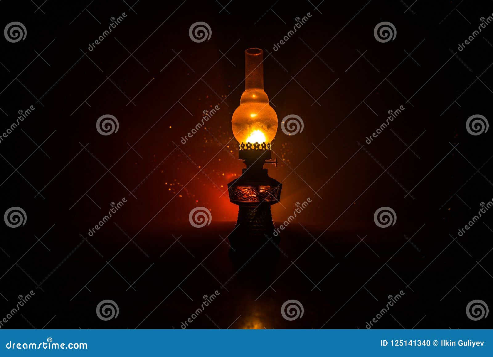 oil lamp lighting up the darkness or burning kerosene lamp background, concept lighting. selective focus