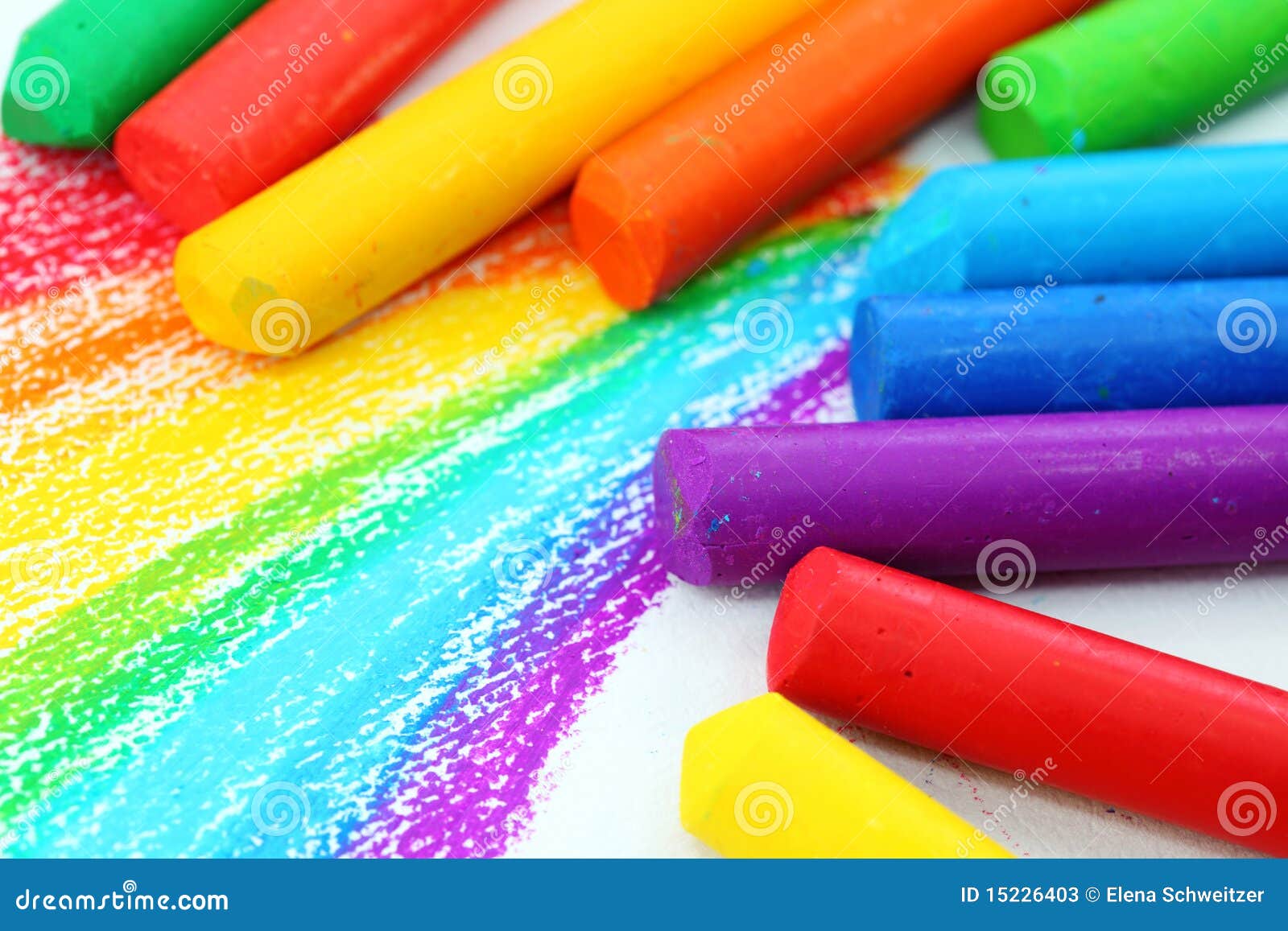 Oil pastel crayons lying on a paper with painted rainbow Stock Photo by  ©aamulya 60603919