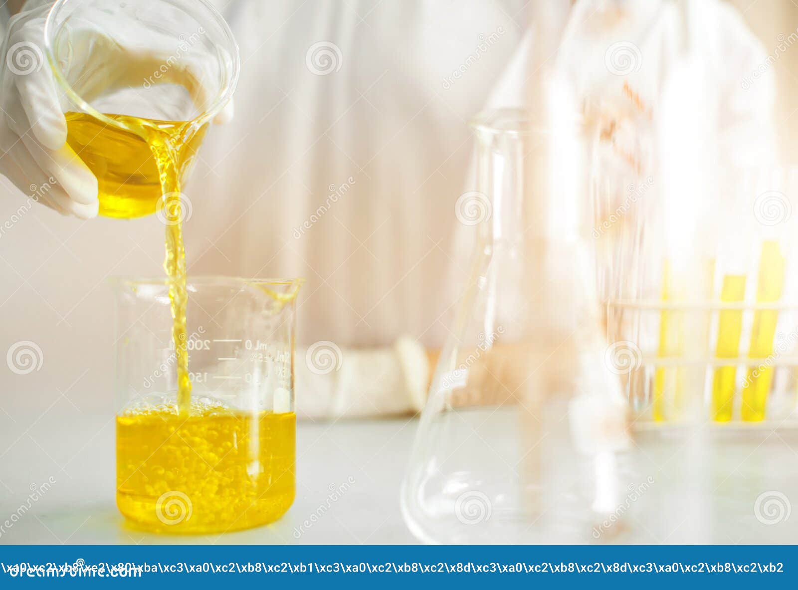 Young Asian scientist with test tube making research in clinical laboratory.Science, chemistry, technology, biology and people con. Oil pouring, Formulating the chemical for medicine,Laboratory research, dropping liquid to test tube