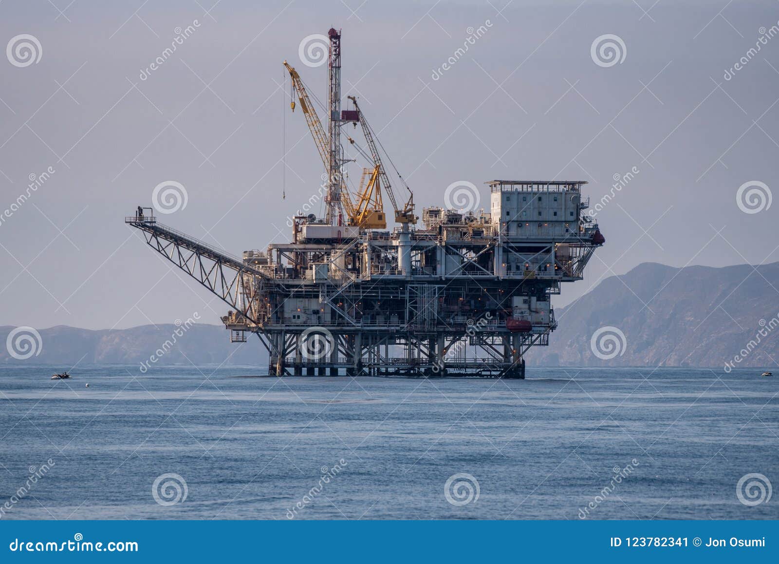 oil production taking place in middle of ocean.