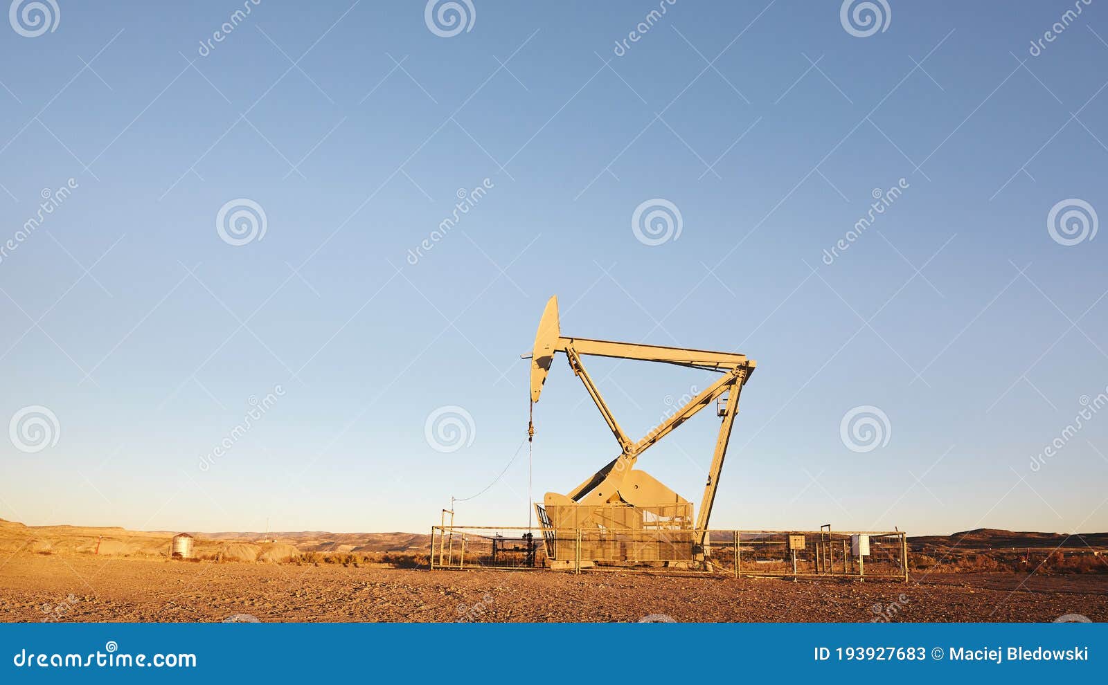 Oil Pump on a Desert at Sunset Stock Image Image of energy, machinery