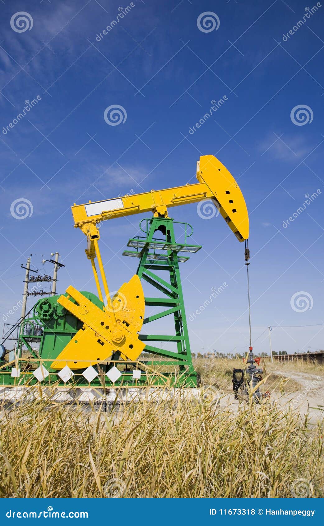 Oil pump jack stock photo. Image of extraction, landscaped 11673318