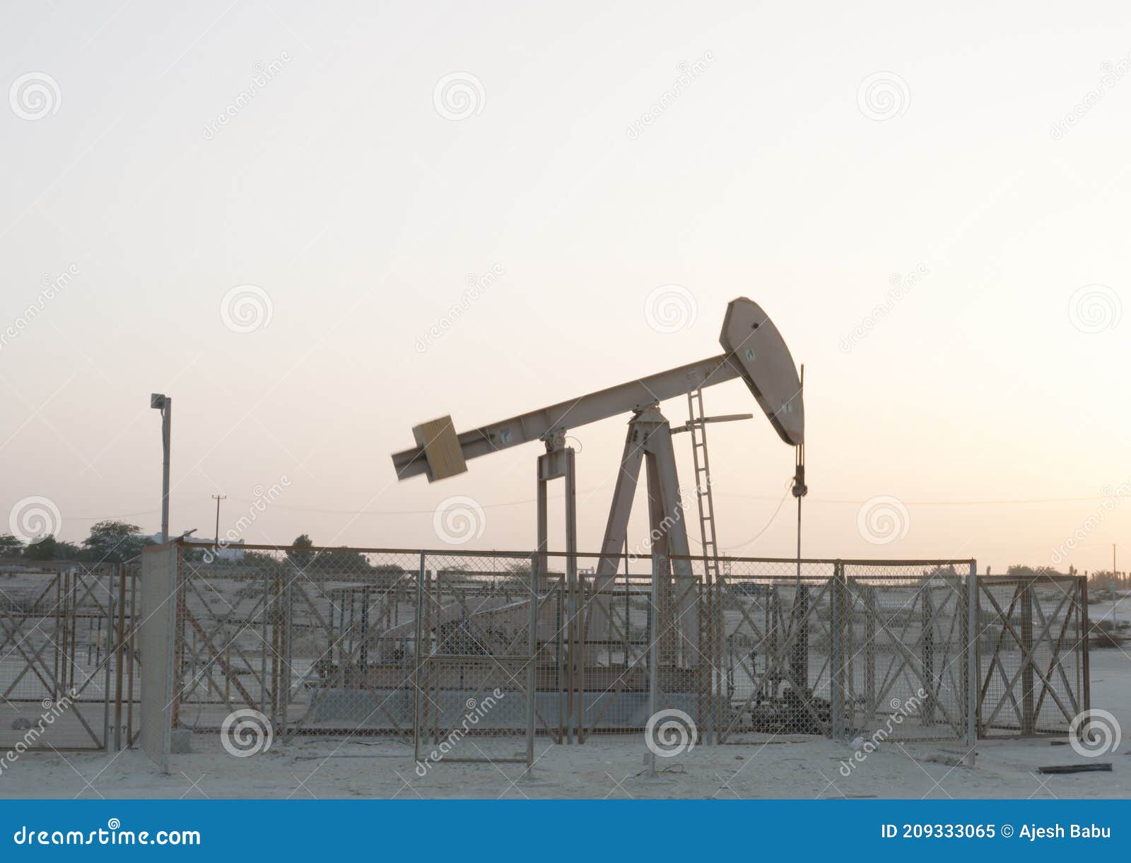Oil Pump,cloudy Day Oil Pumping from Oil Well Stock Image Image of