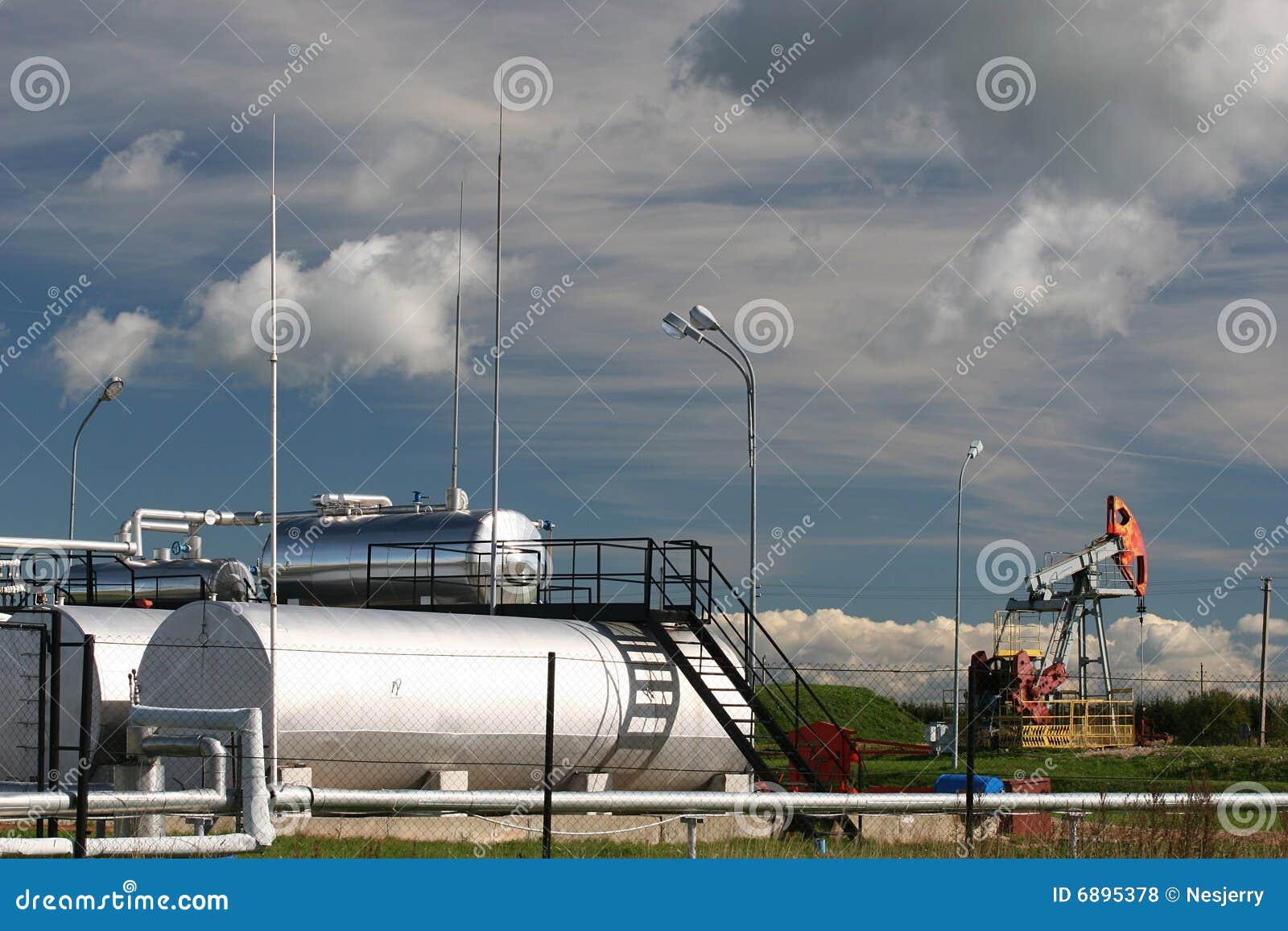 Oil pump and storage tanks stock photo. Image of station 6895378