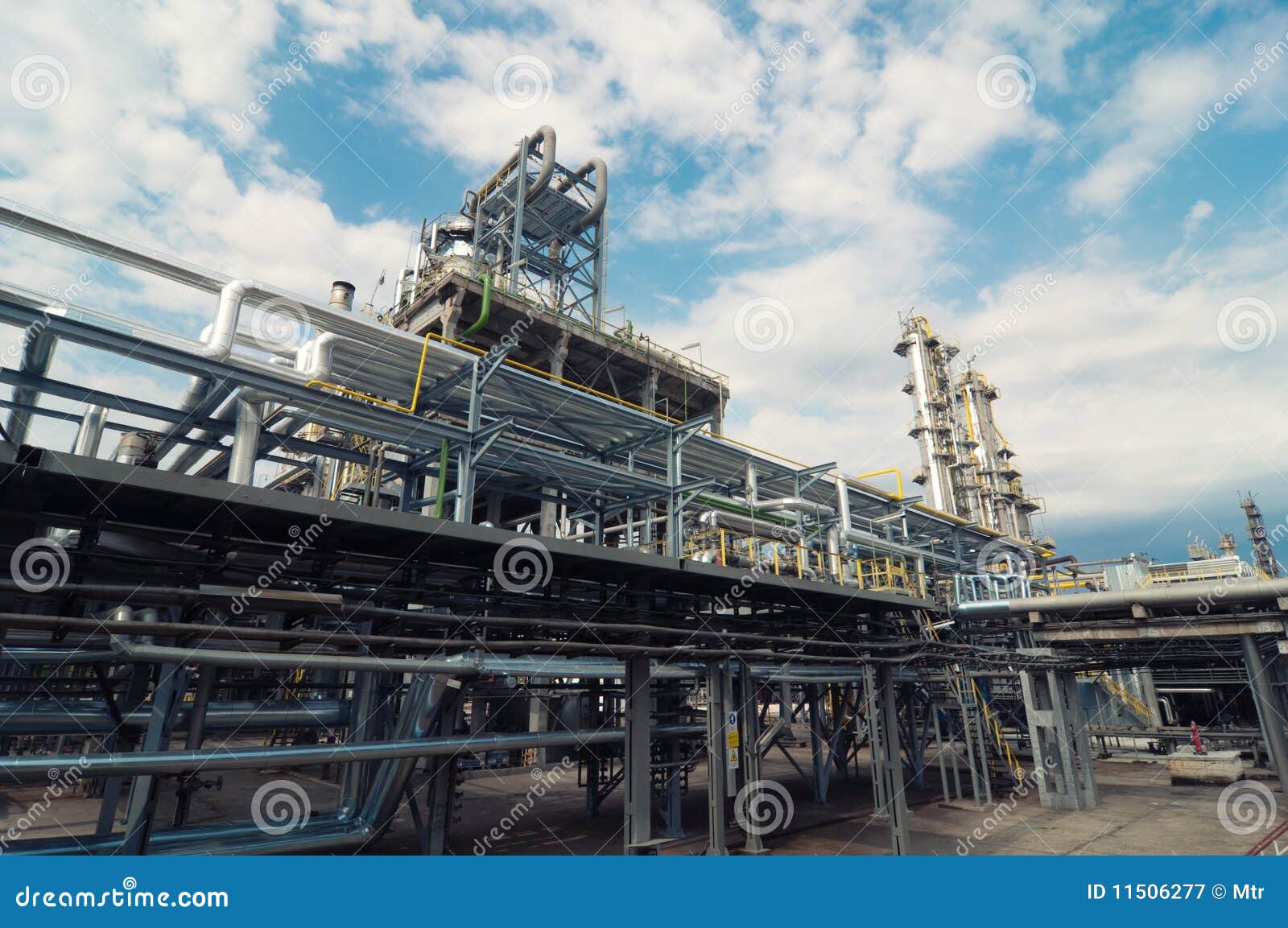 The towers and pipes of an oil refinery.