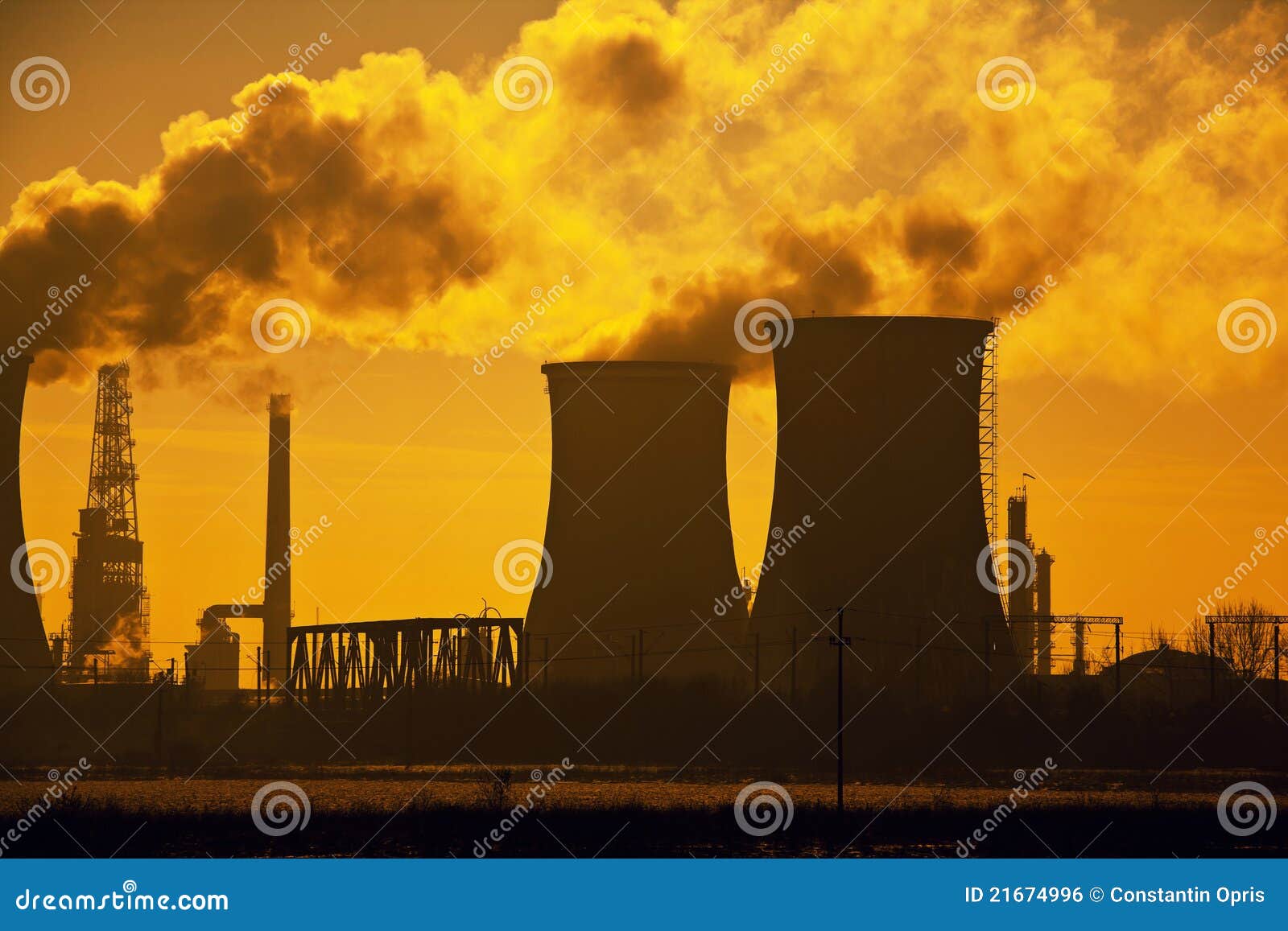 Oil refinery pollution, evacuation towers with smoke, dramatic sky.