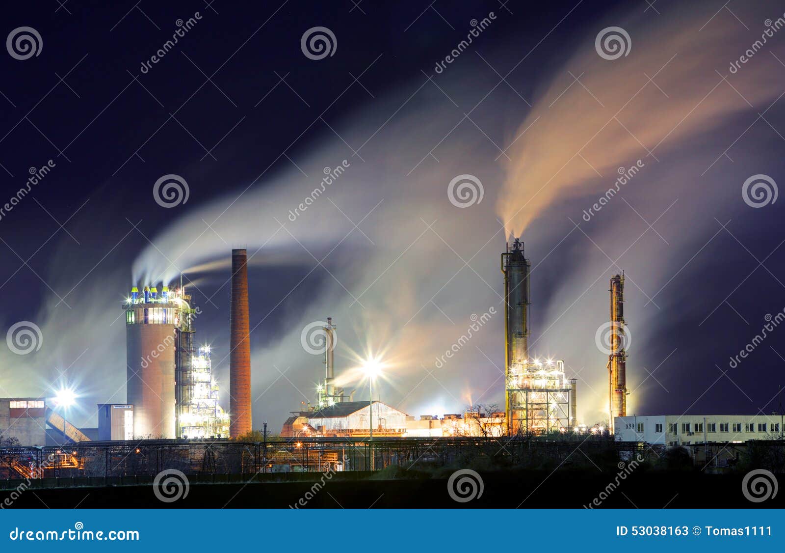 oil refinery with vapor - petrochemical industry at night