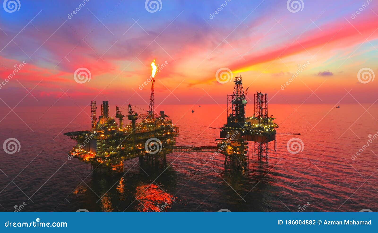 oil rig at late evening offshore areal photography during sunset