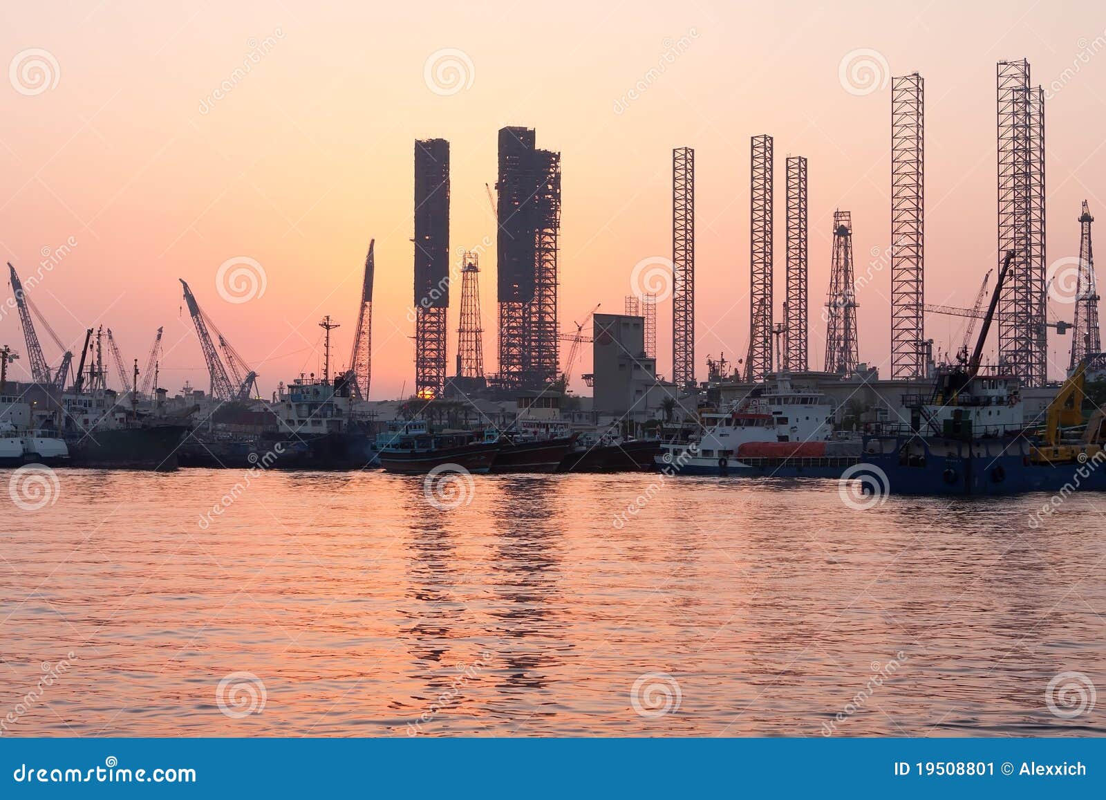 oil rigs at sunset, sharjah, uae