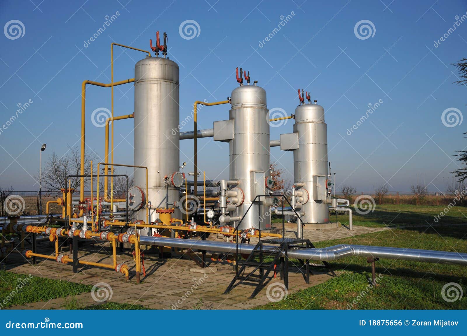 Oil tanks and pipes stock photo. Image of pipeline, railing 18875656