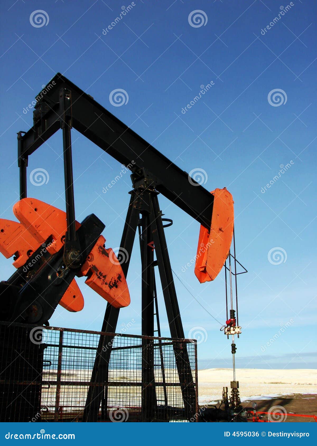 Oilfield Pump Jack Rocking Horse Or Pumpjack Over A Wellhead Royalty