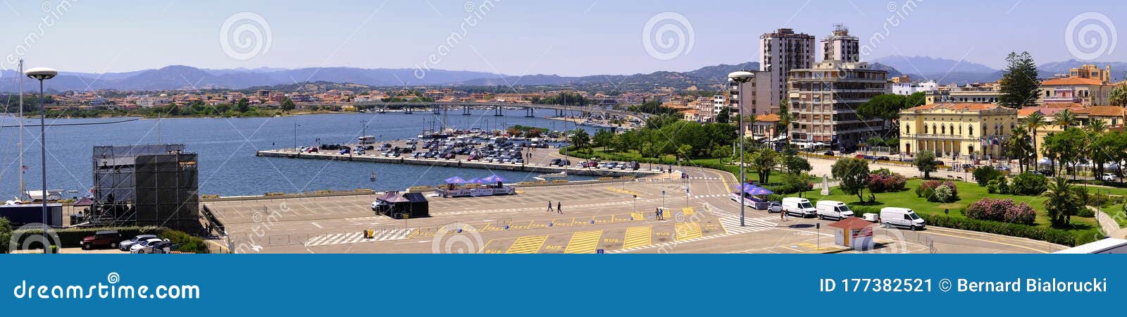 olbia, sardinia / italy - 2019/07/21: panoramic view of olbia port and yacht marina shore area with citi hall - municipio di olbia
