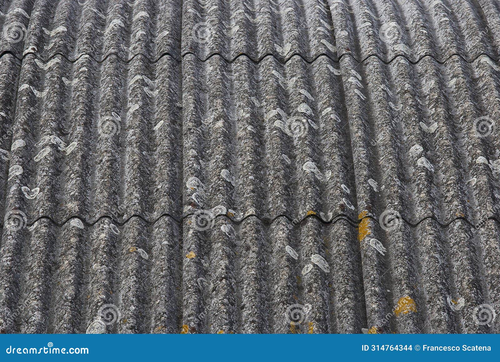 old aged and damaged dangerous roof made of prefabricated and wave-d panels