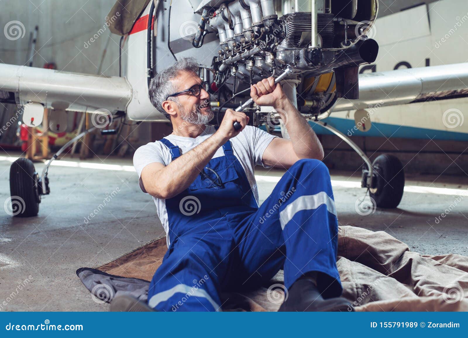 Aircraft Mechanic Repairs An Aircraft Engine In An Airport Hangar Stock Image Image Of Engine Aero