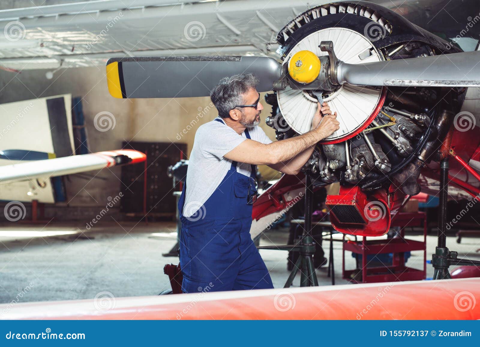 Aircraft Mechanic Repairs An Aircraft Engine In An Airport Hangar Stock Image Image Of Safety Aircraft