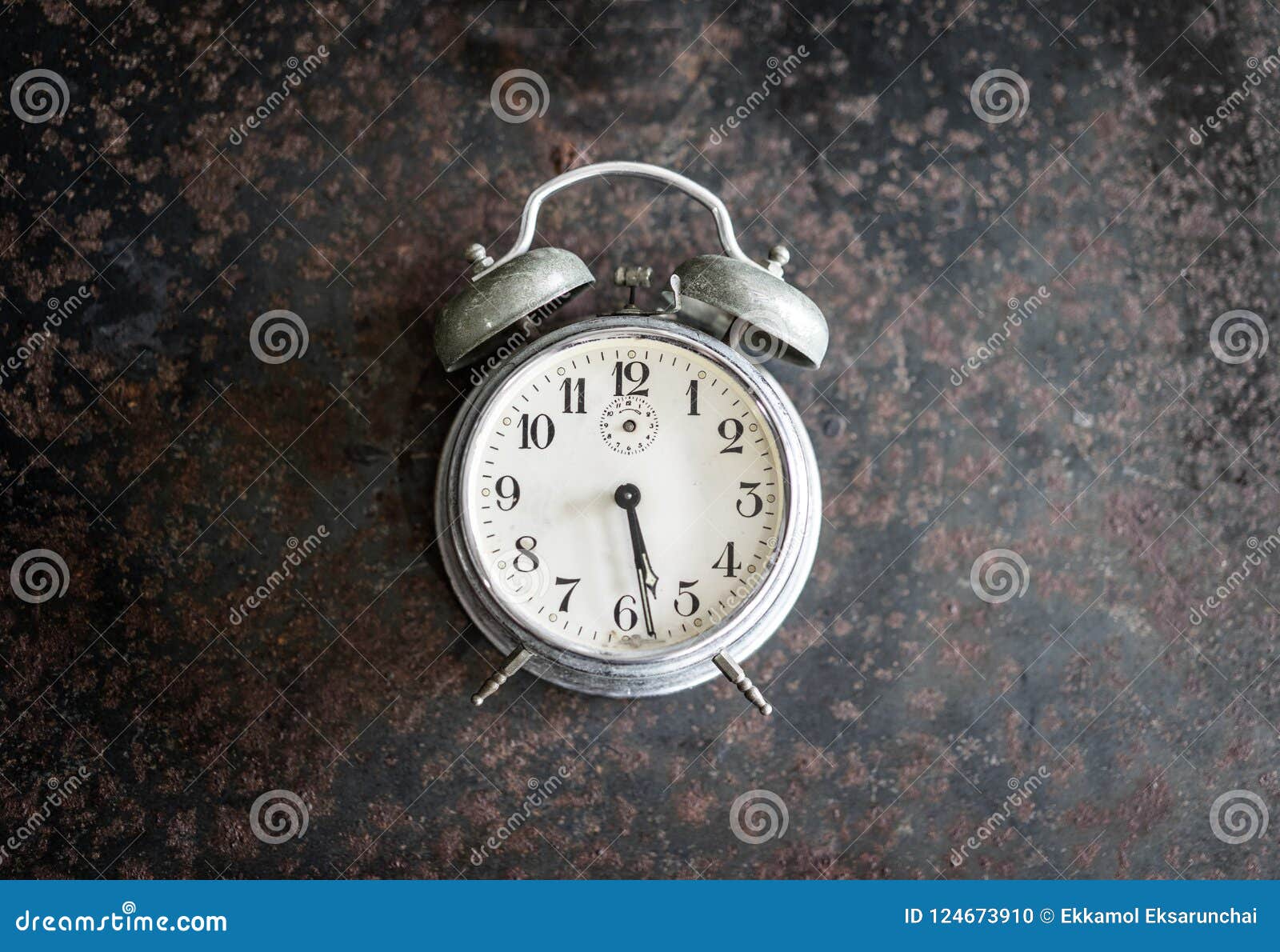 Old Alarm Clock on the Ancient Iron Table. Stock Photo Image of clock