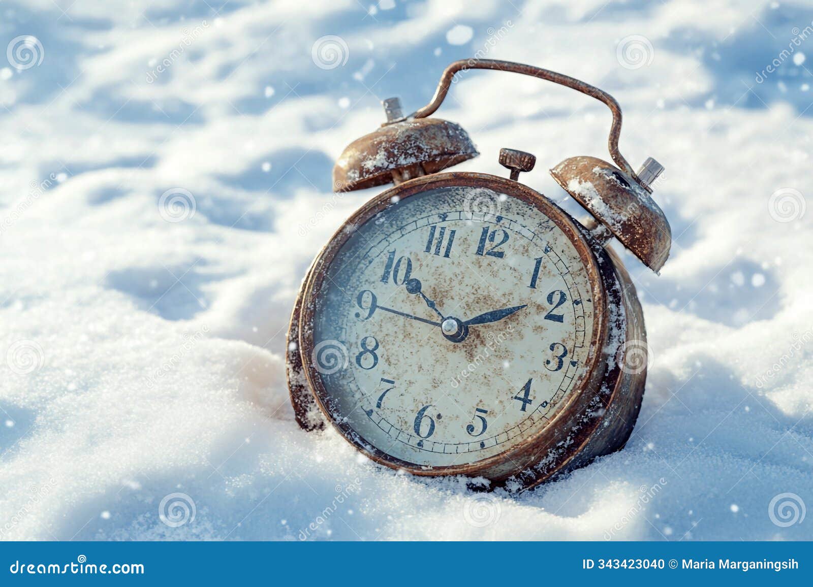 old alarm clock on snow. time and memories concept. new year inspirational and motivational background