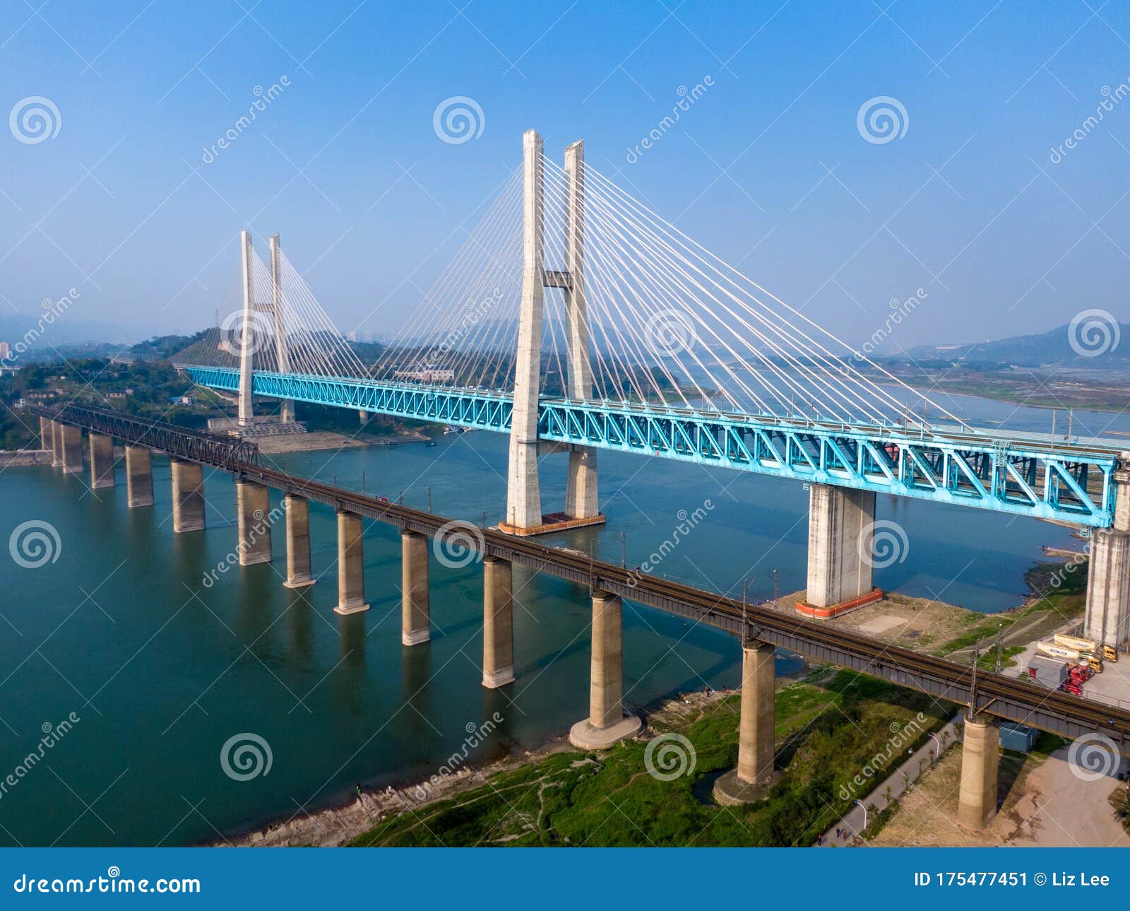 bird view of old and new baishatuo yangtze river railway bridge under blue sky