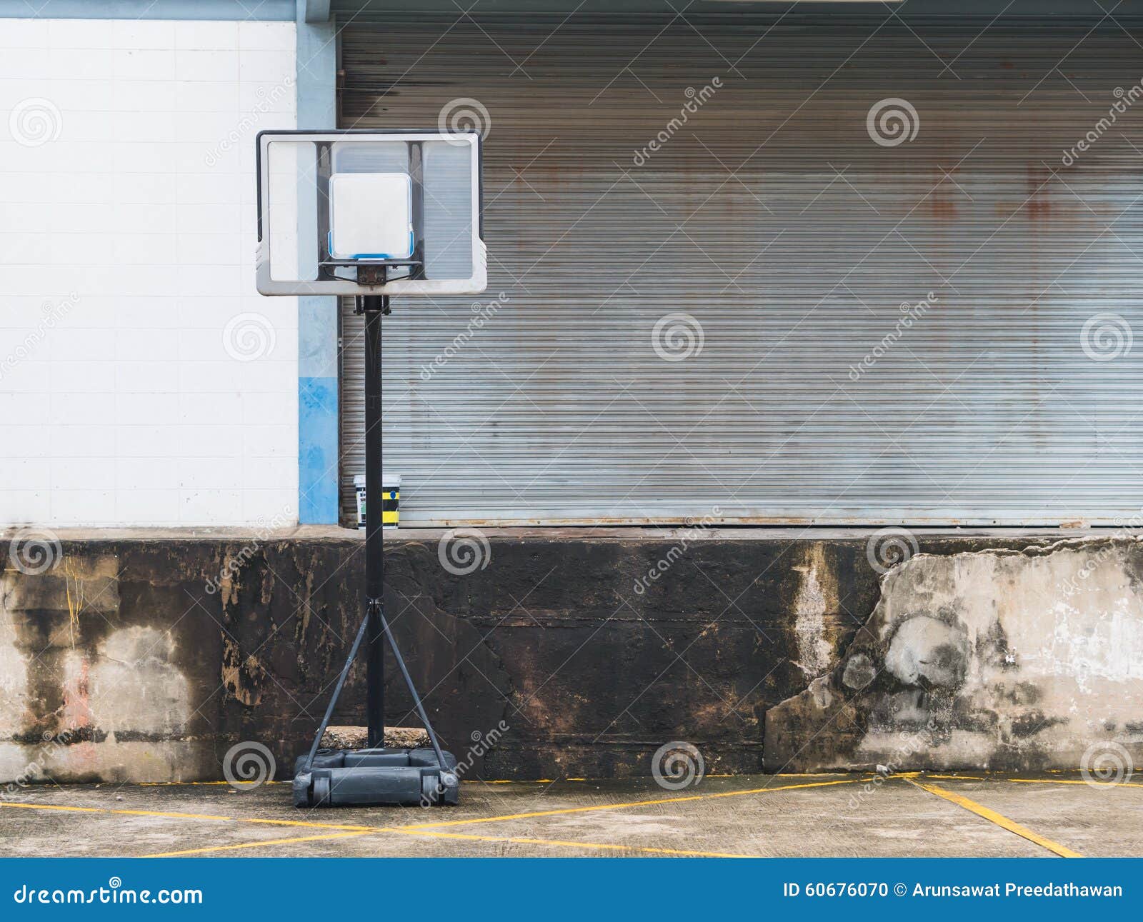 Old Basketball Pole Near the Shutter Door. Stock Photo Image of